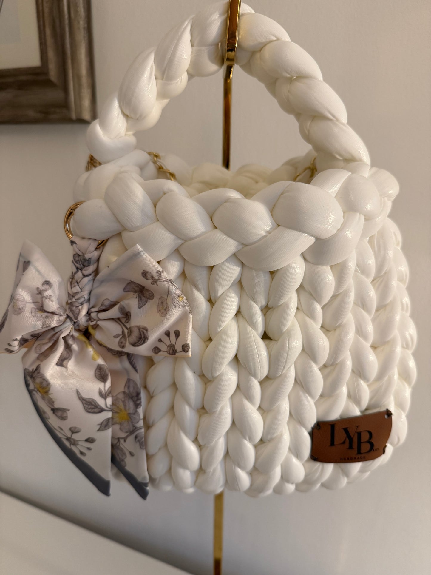 Interior view of Arctic chunky braided white bag showing gold chain detail