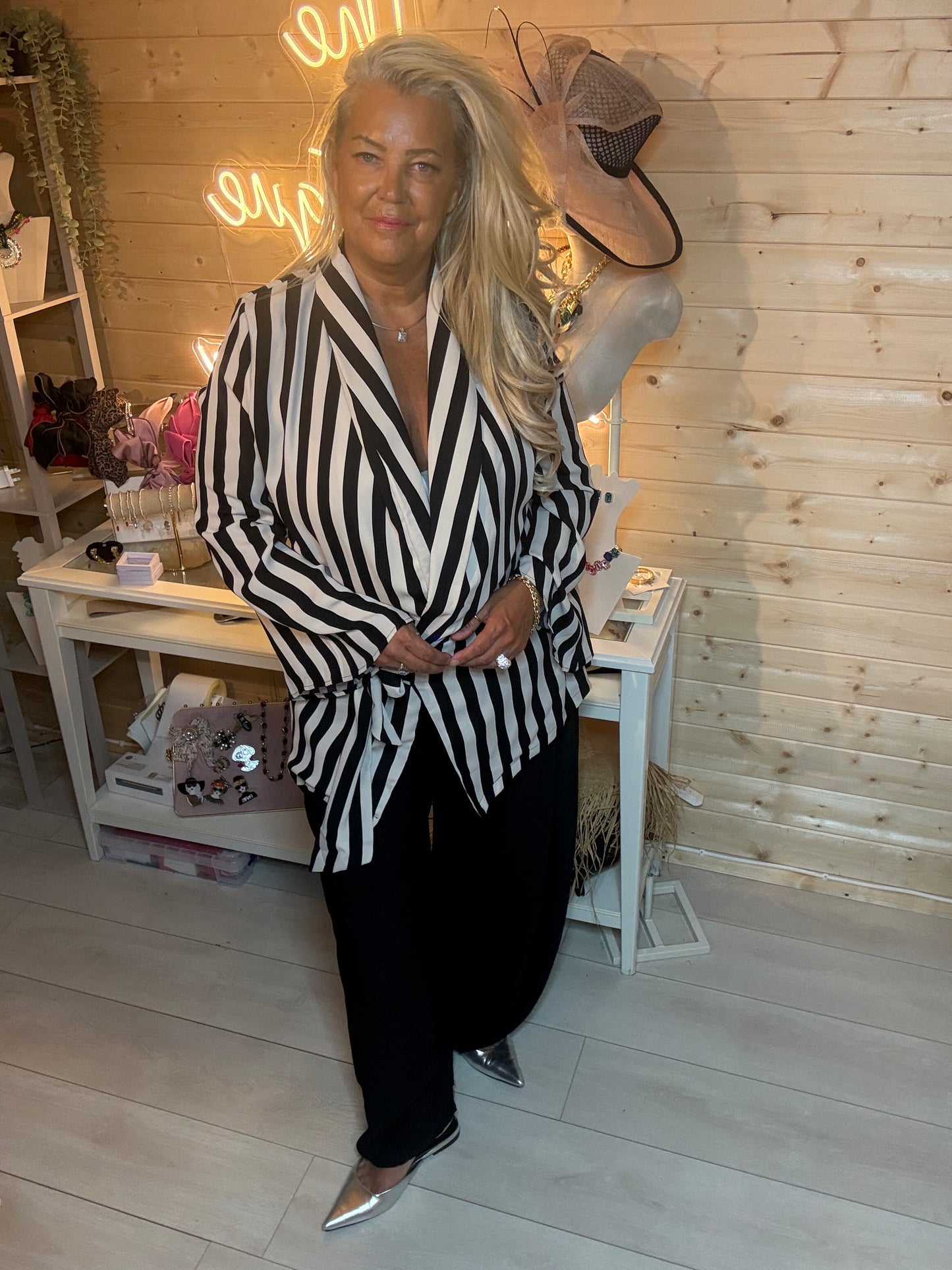 Stripe wrap jacket full length boutique shot – showing bold vertical stripe pattern, tie waist and asymmetric hem