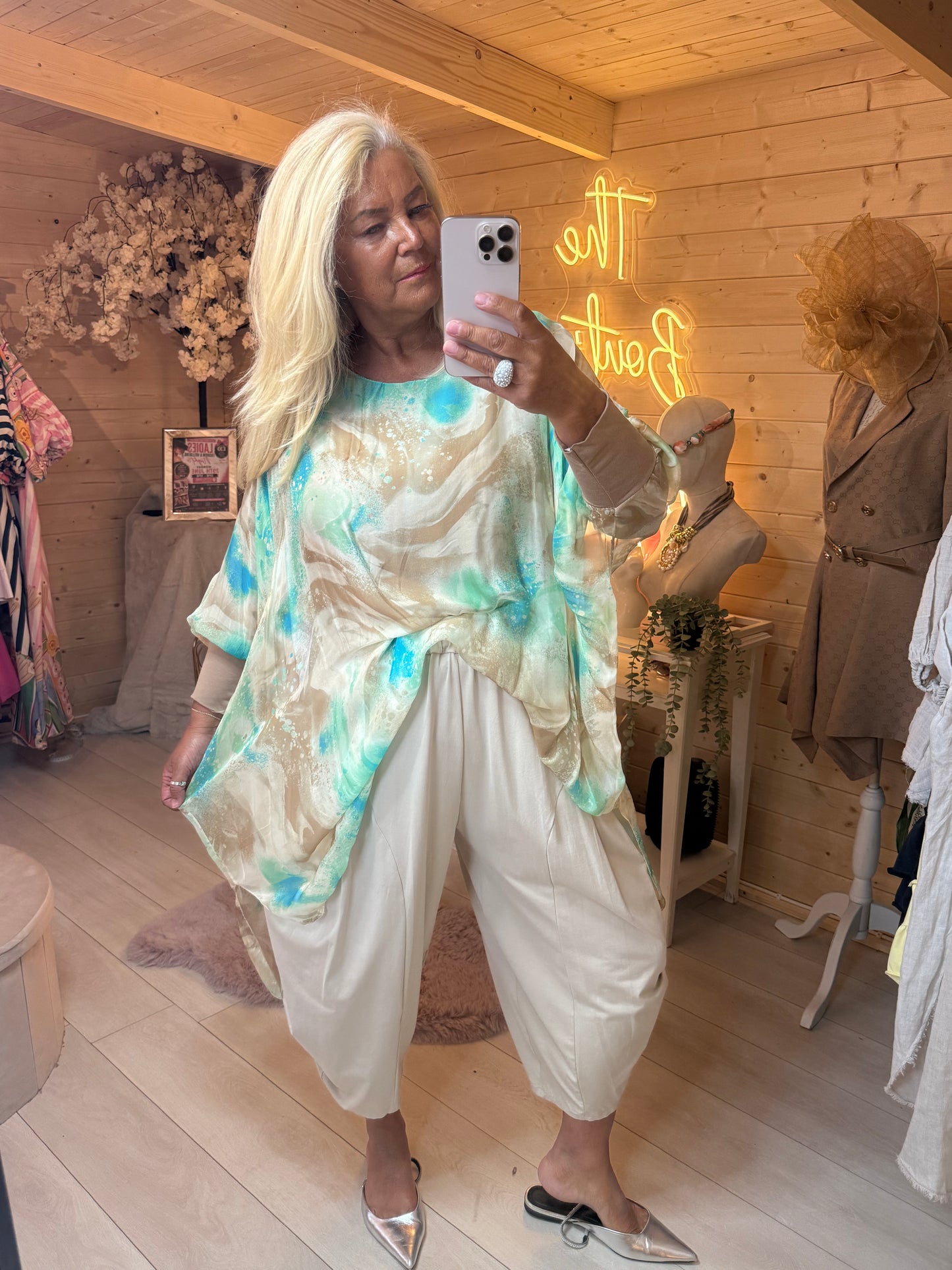 Aqua marble print batwing oversized top worn with cream slouch trousers front view