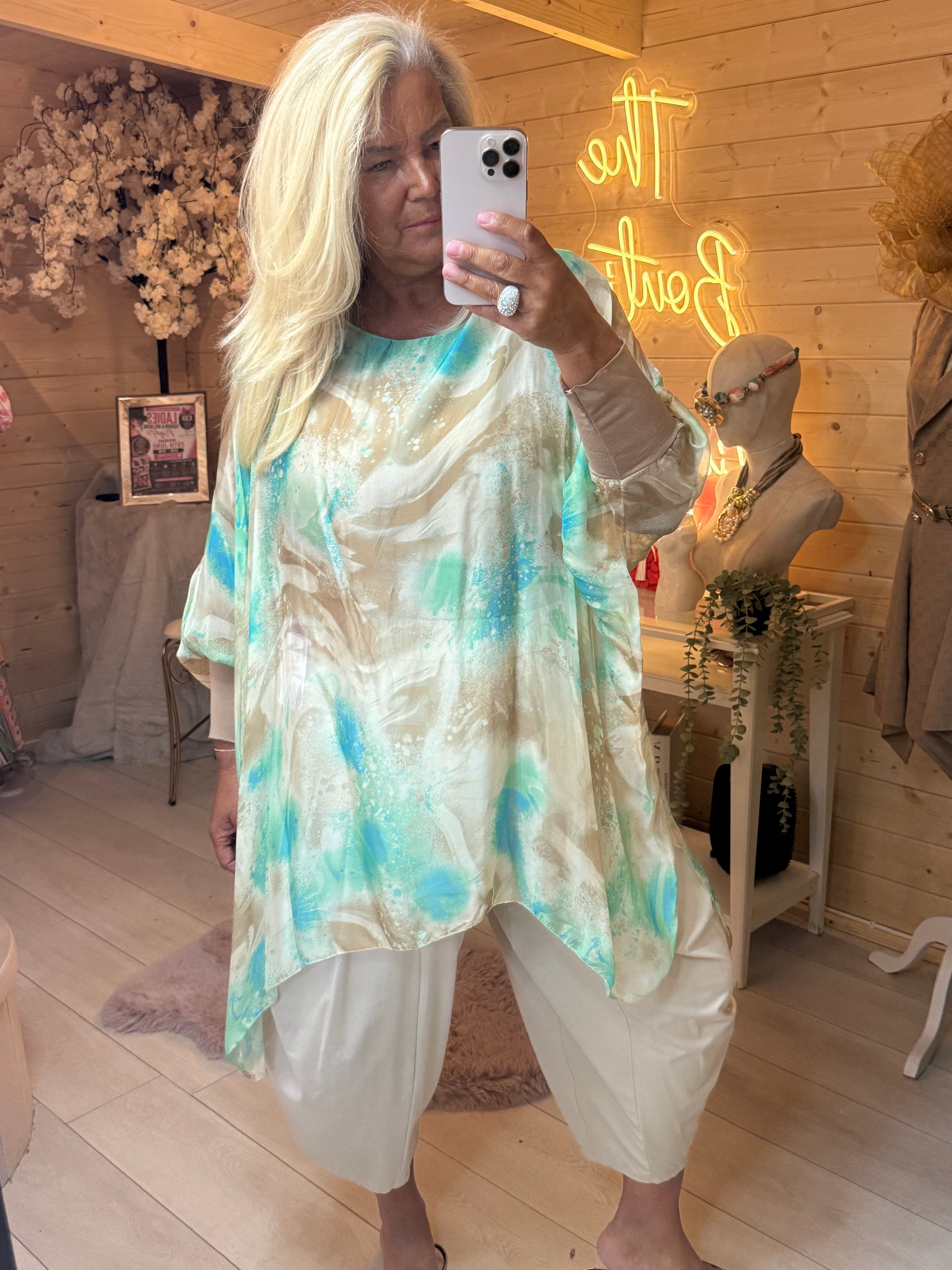 Aqua marble print batwing top side view with silver mules