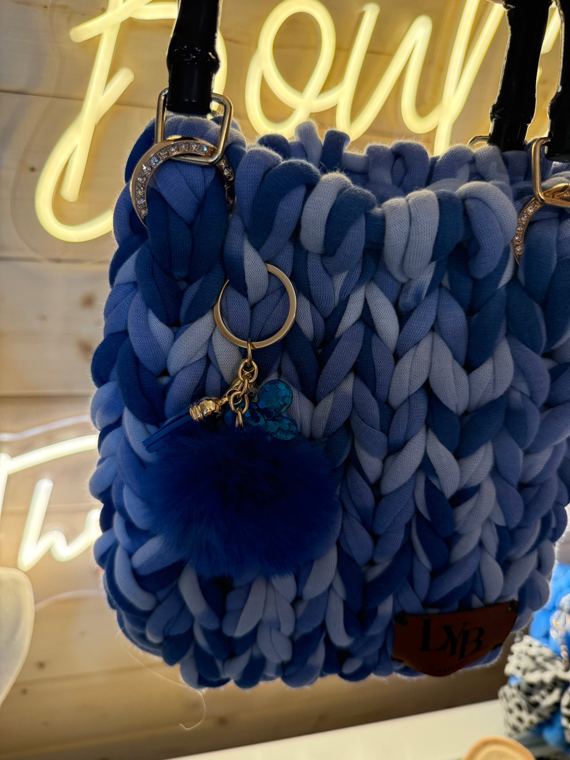 Azure ombré chunky knit bamboo tote bag side view with pom pom charm detail