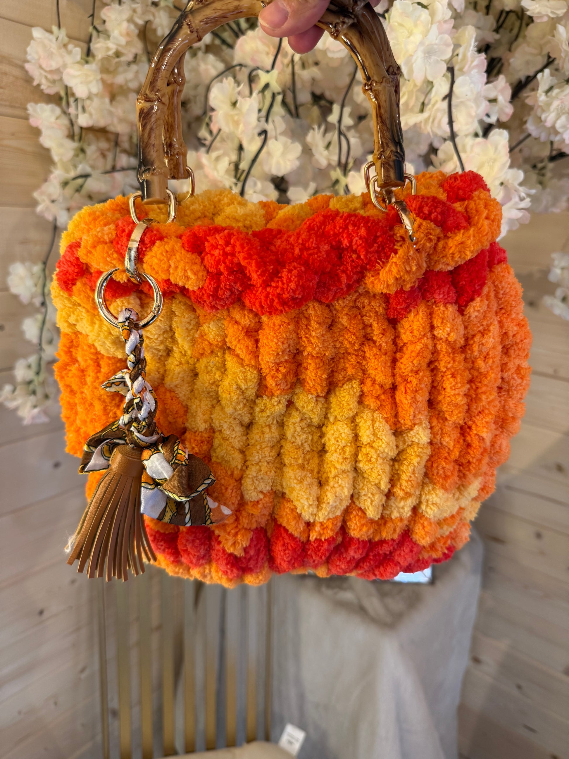 Sunset blaze chunky velvet knit bamboo bag front view showing yellow orange and red ombré knit
