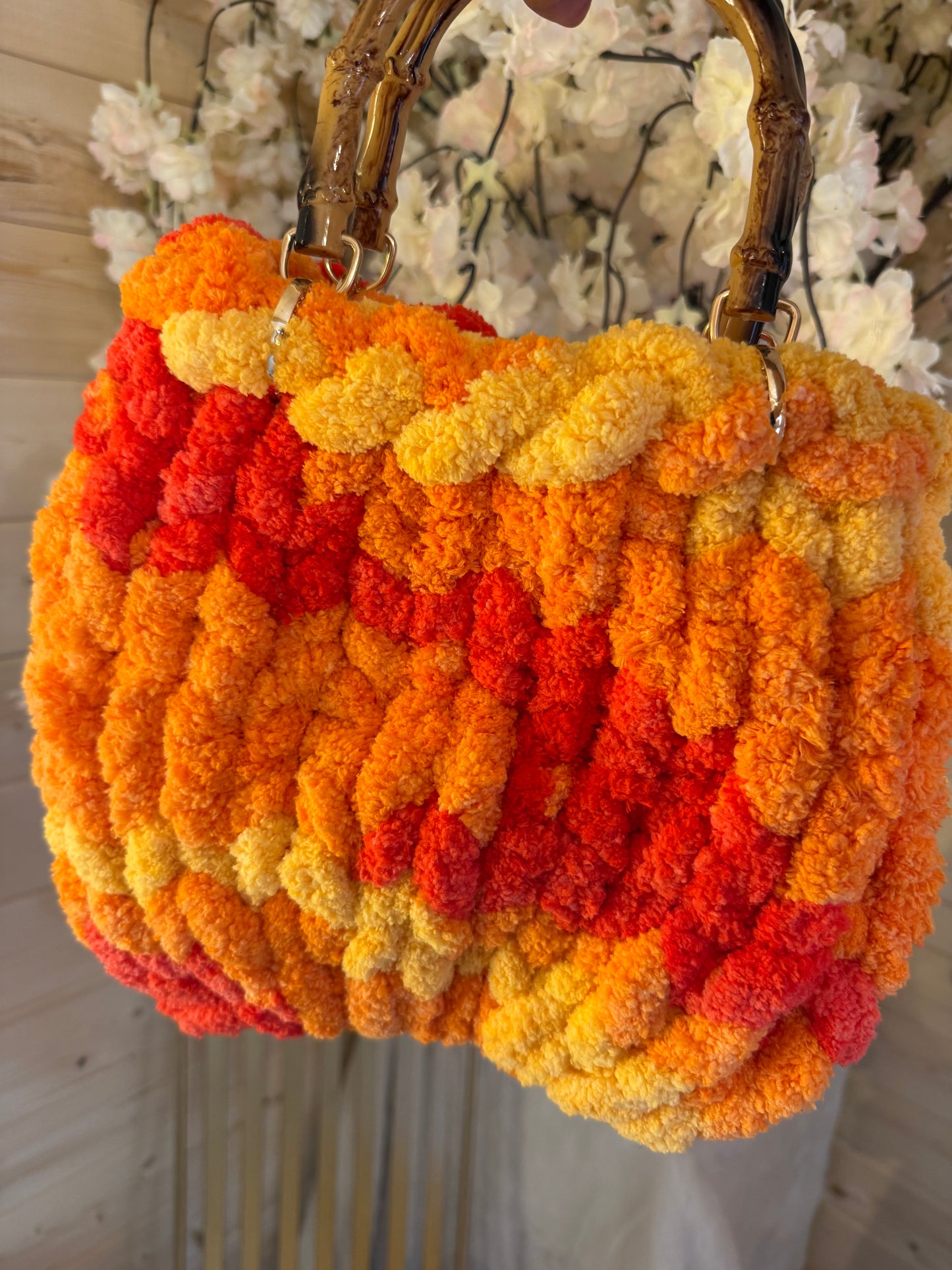 Sunset blaze chunky velvet knit bamboo bag back view showing ribbed knit texture and bamboo handles