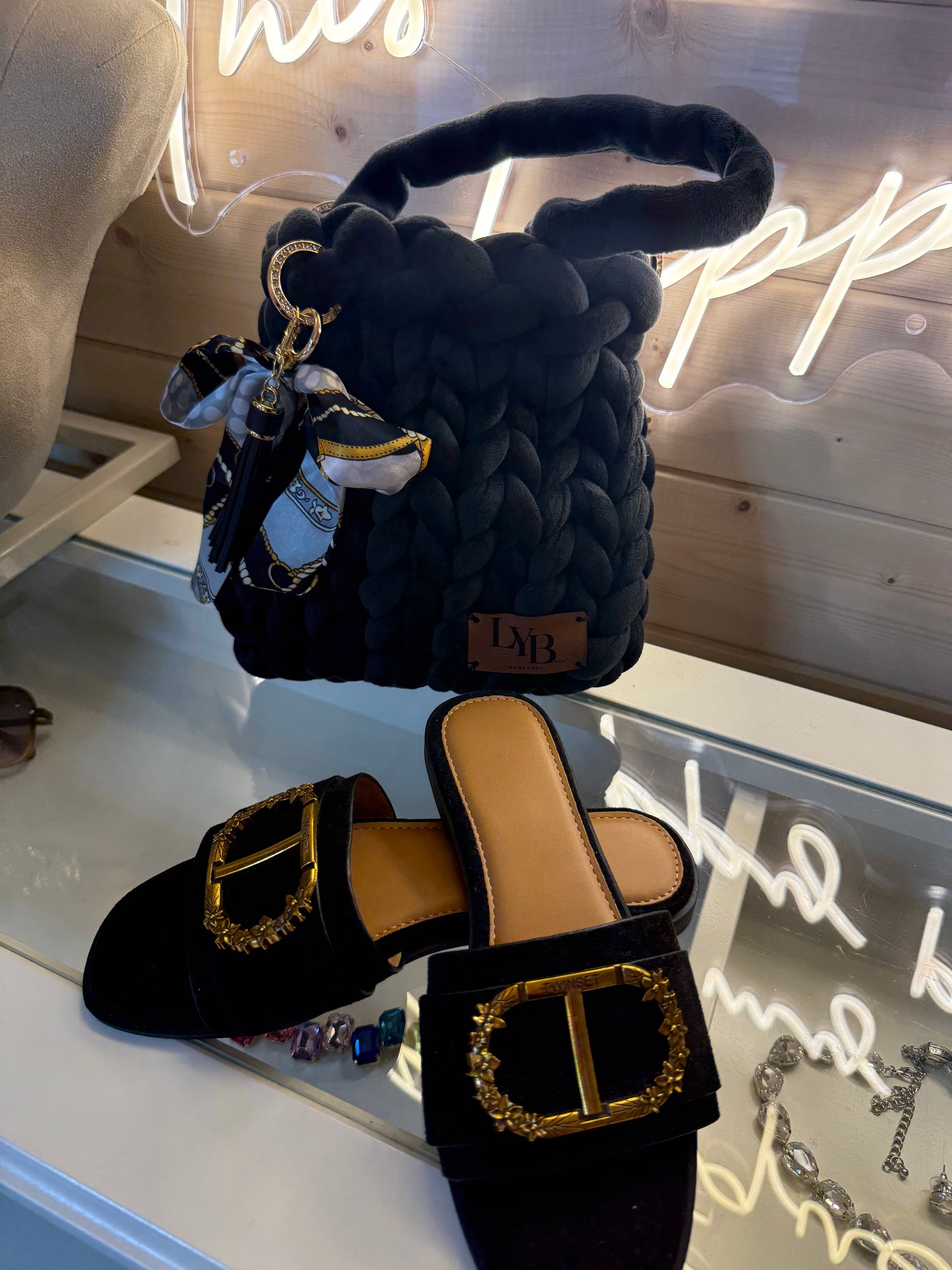 Midnight noir velvet chunky braid bucket bag styled with black velvet mules showing full outfit