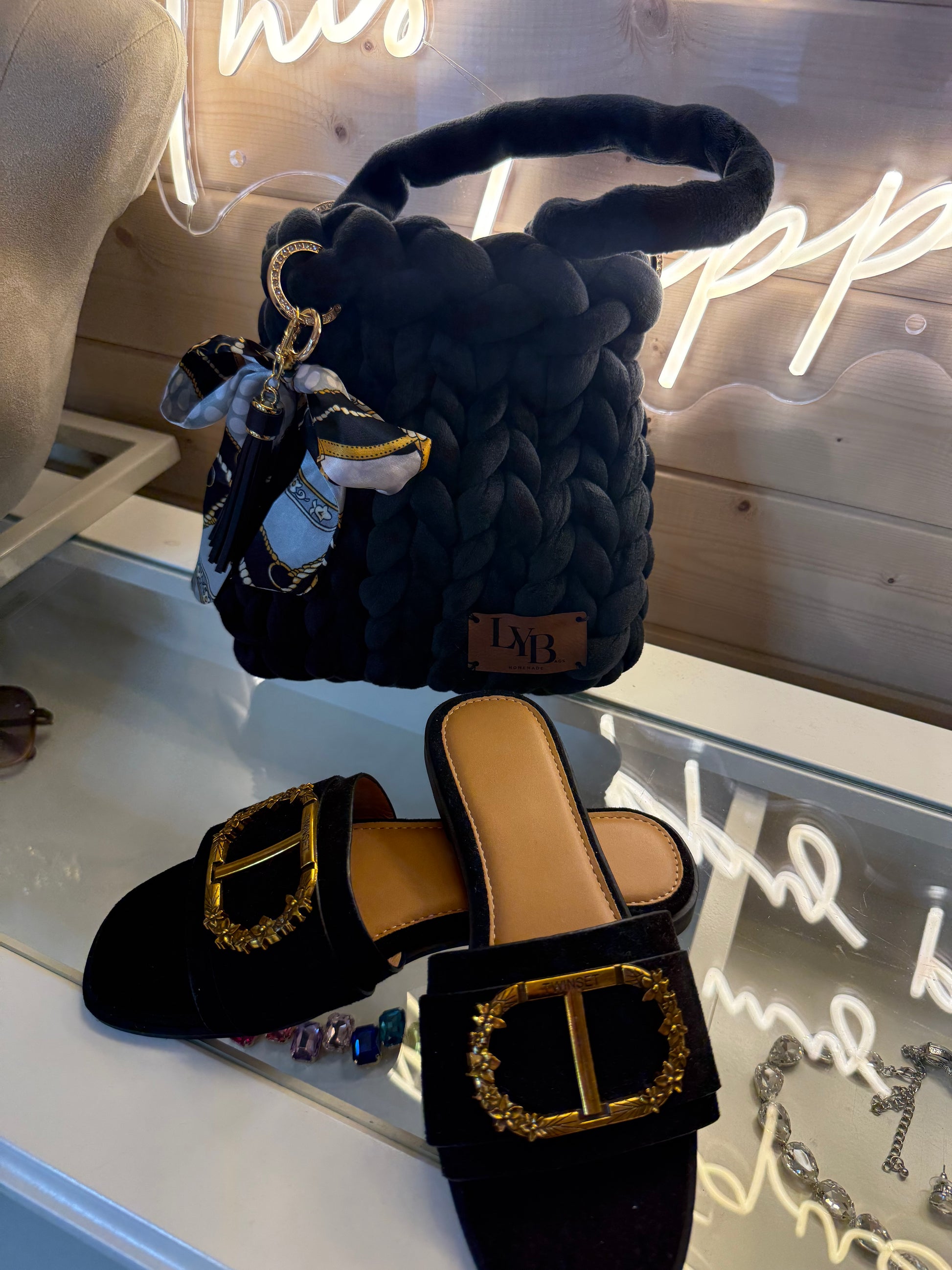 Midnight noir velvet chunky braid bucket bag styled with black velvet mules showing full outfit
