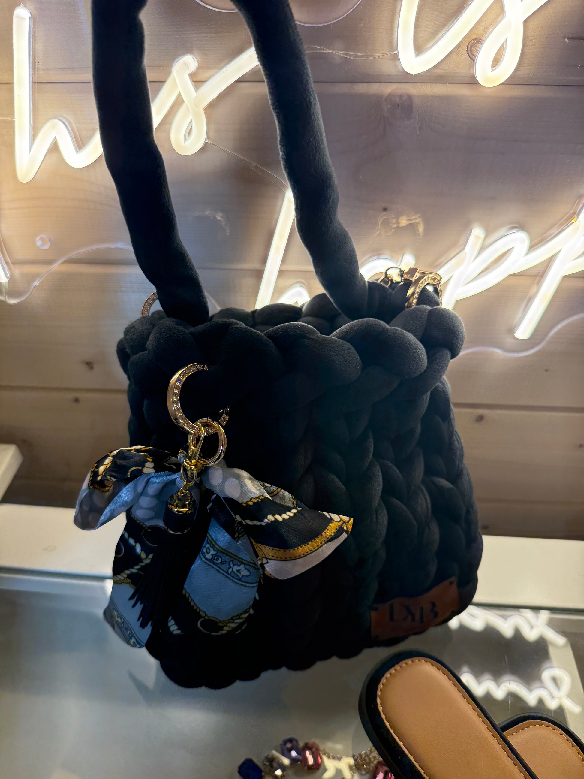 Midnight noir velvet chunky braid bucket bag back view showing ULB branded leather label and diamanté crescent ring