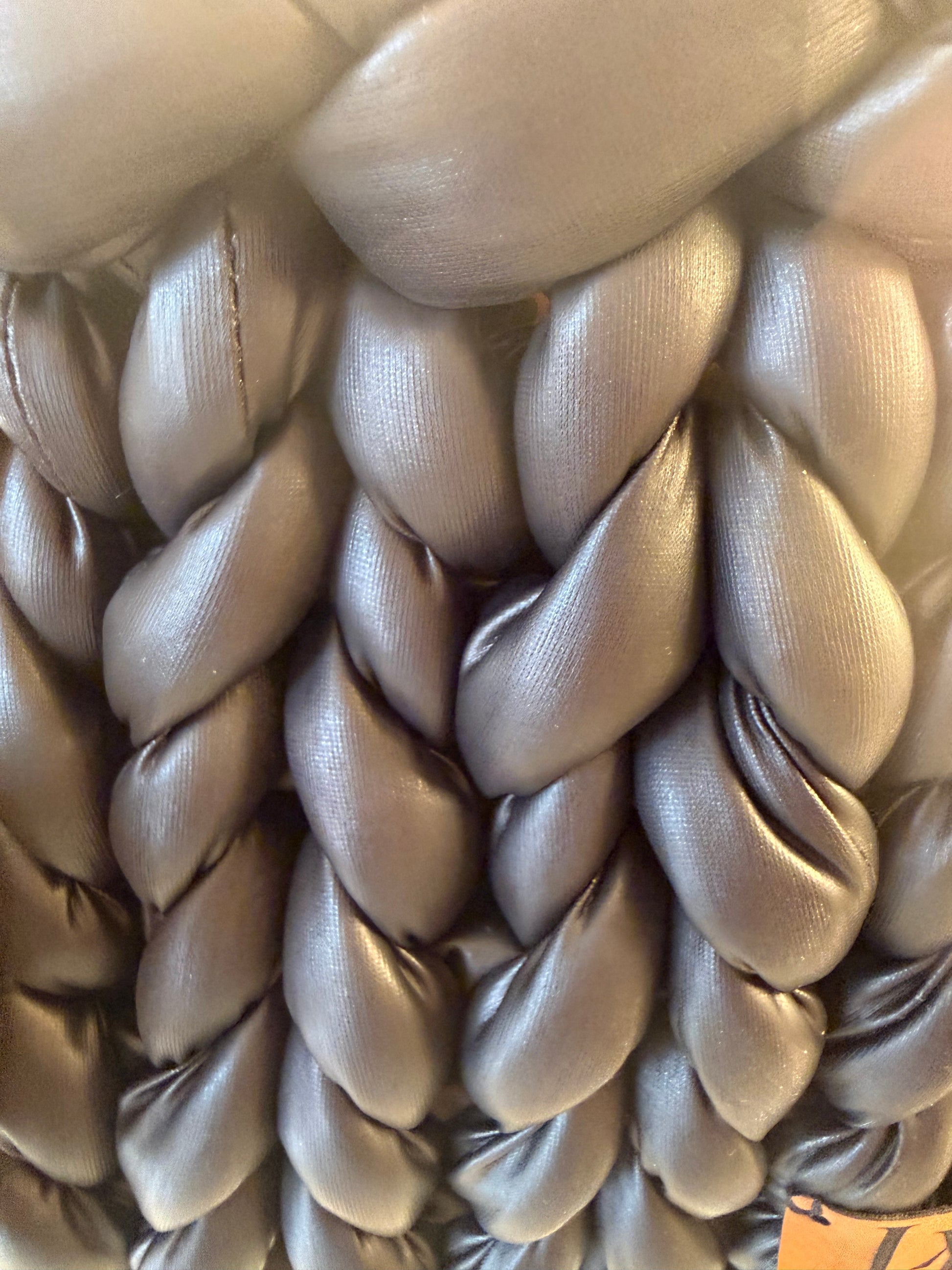 Wild at heart chunky braid faux leather bucket bag close up of matte black chunky braid faux leather texture