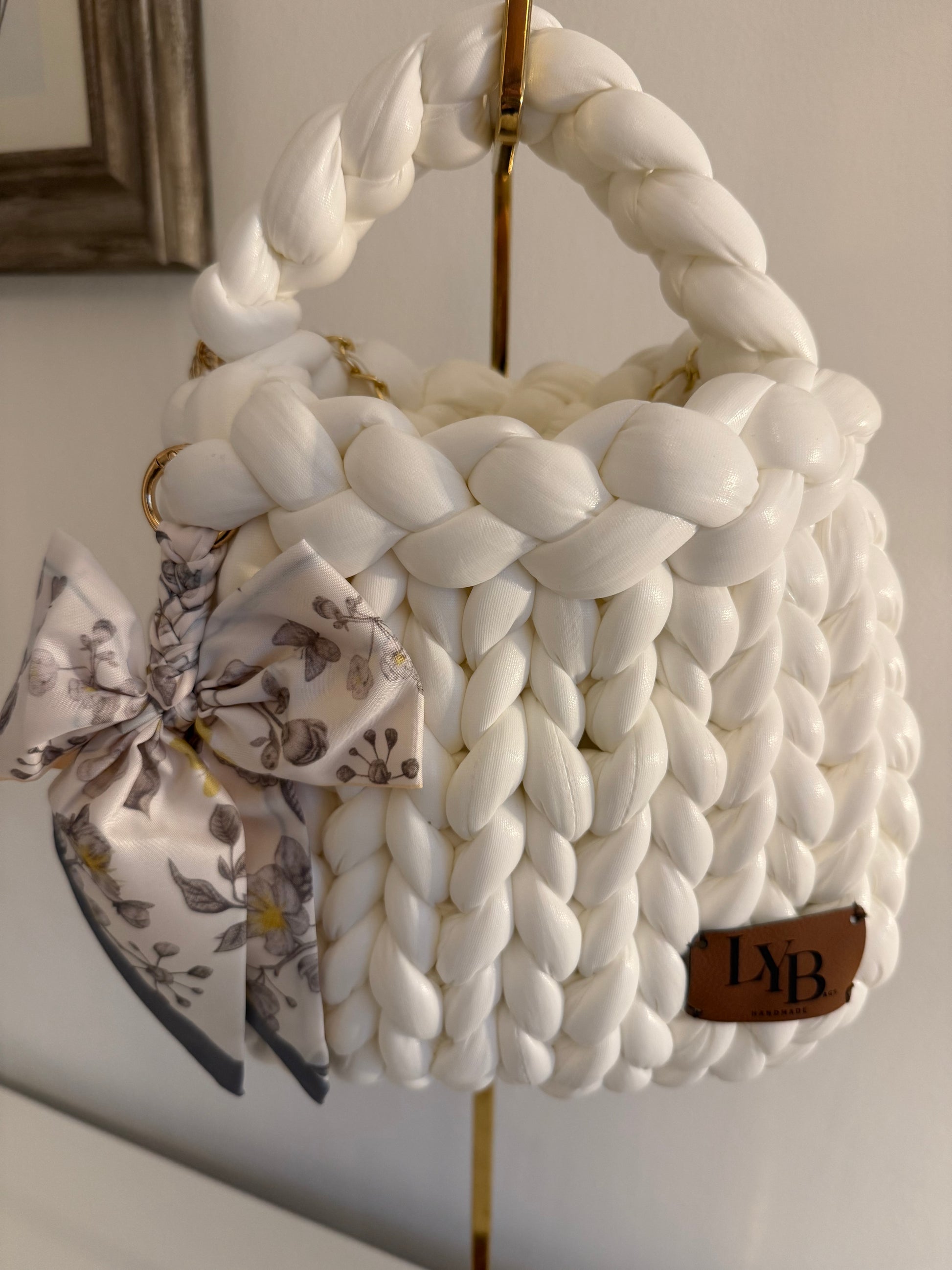 Interior view of Arctic chunky braided white bag showing gold chain detail