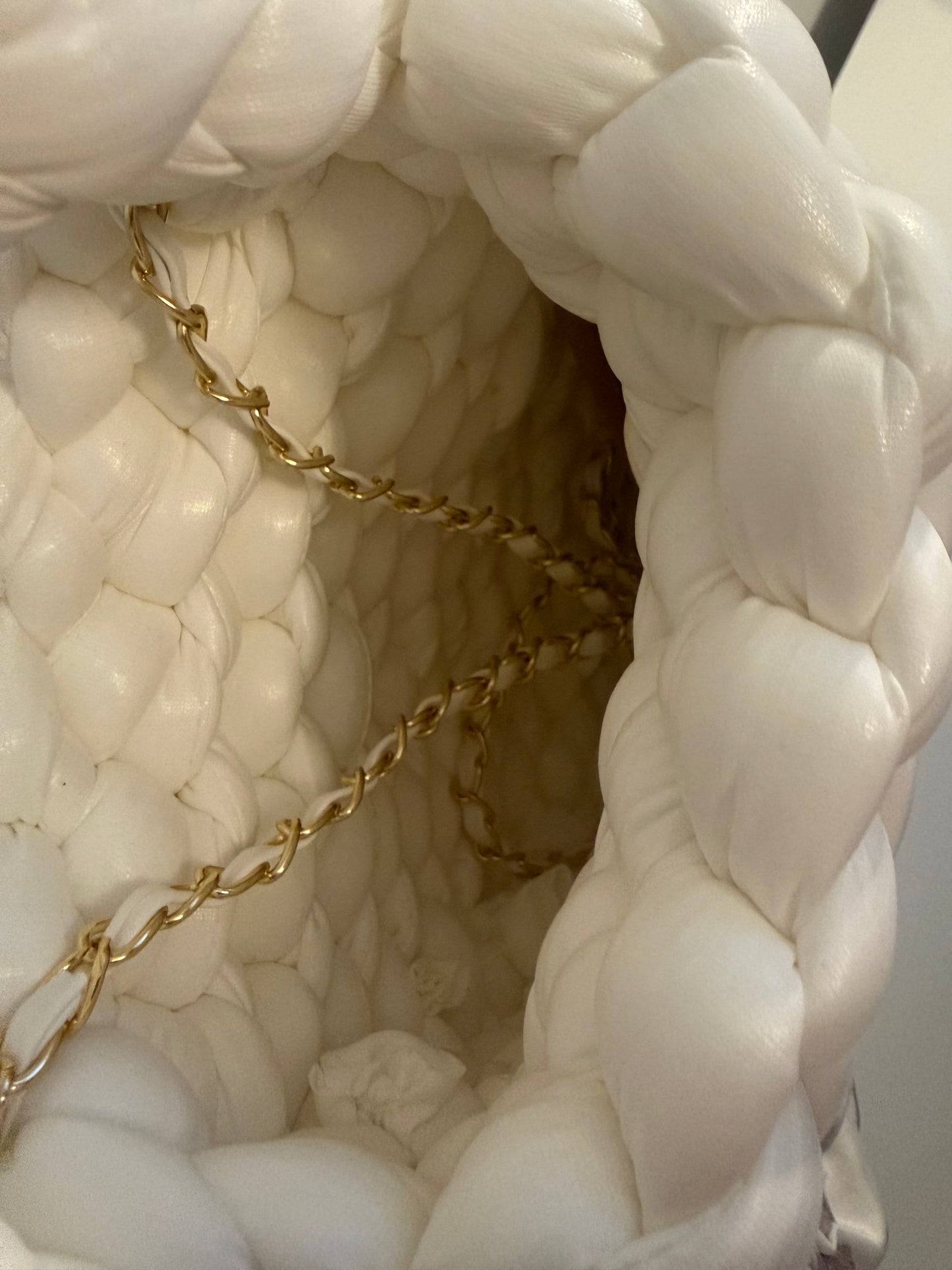 Arctic white braided handbag with gold hardware and floral bow detail - side view