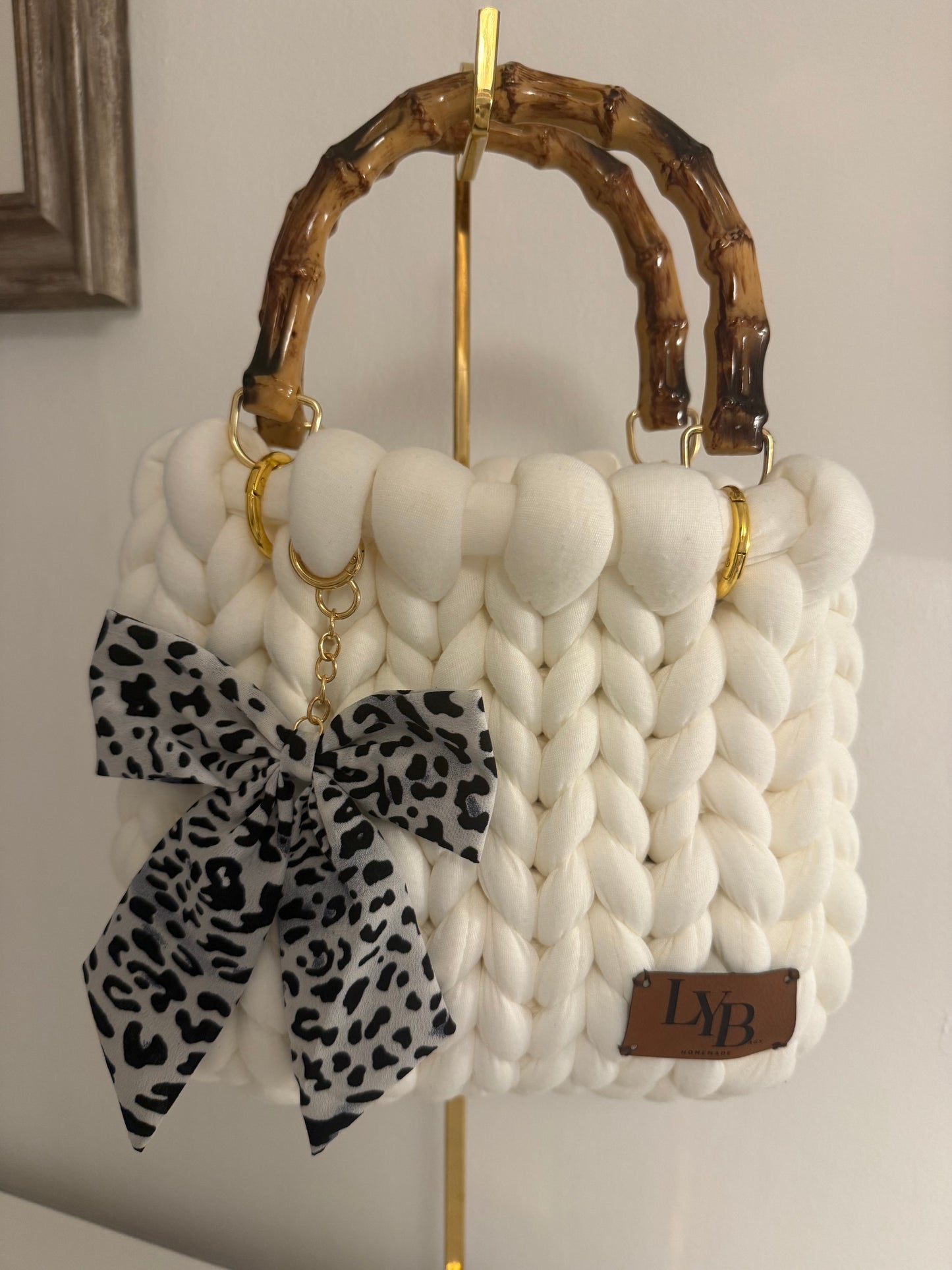 Blanca white chunky bubble braid bag with bamboo handle and monochrome leopard print bow charm - front view