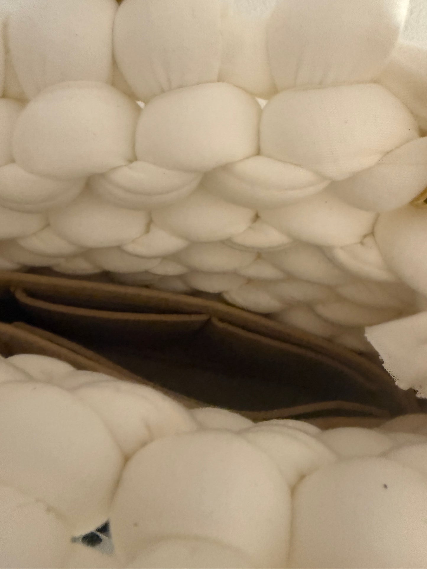 Interior view of Blanca white chunky bubble braid bag showing rich dark inner liner