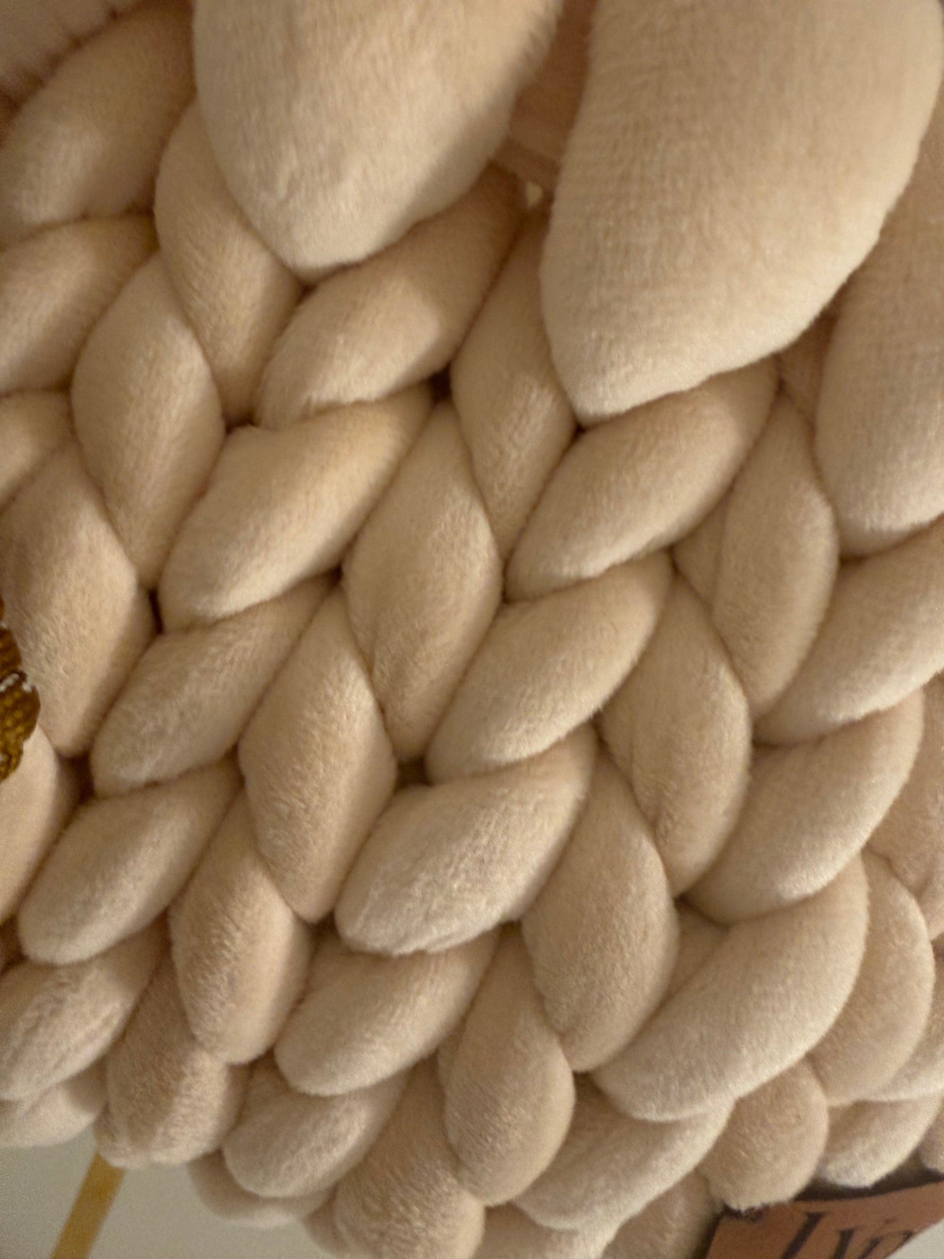 Close-up of cream velvet chunky bubble braid texture on Mocha luxury handbag