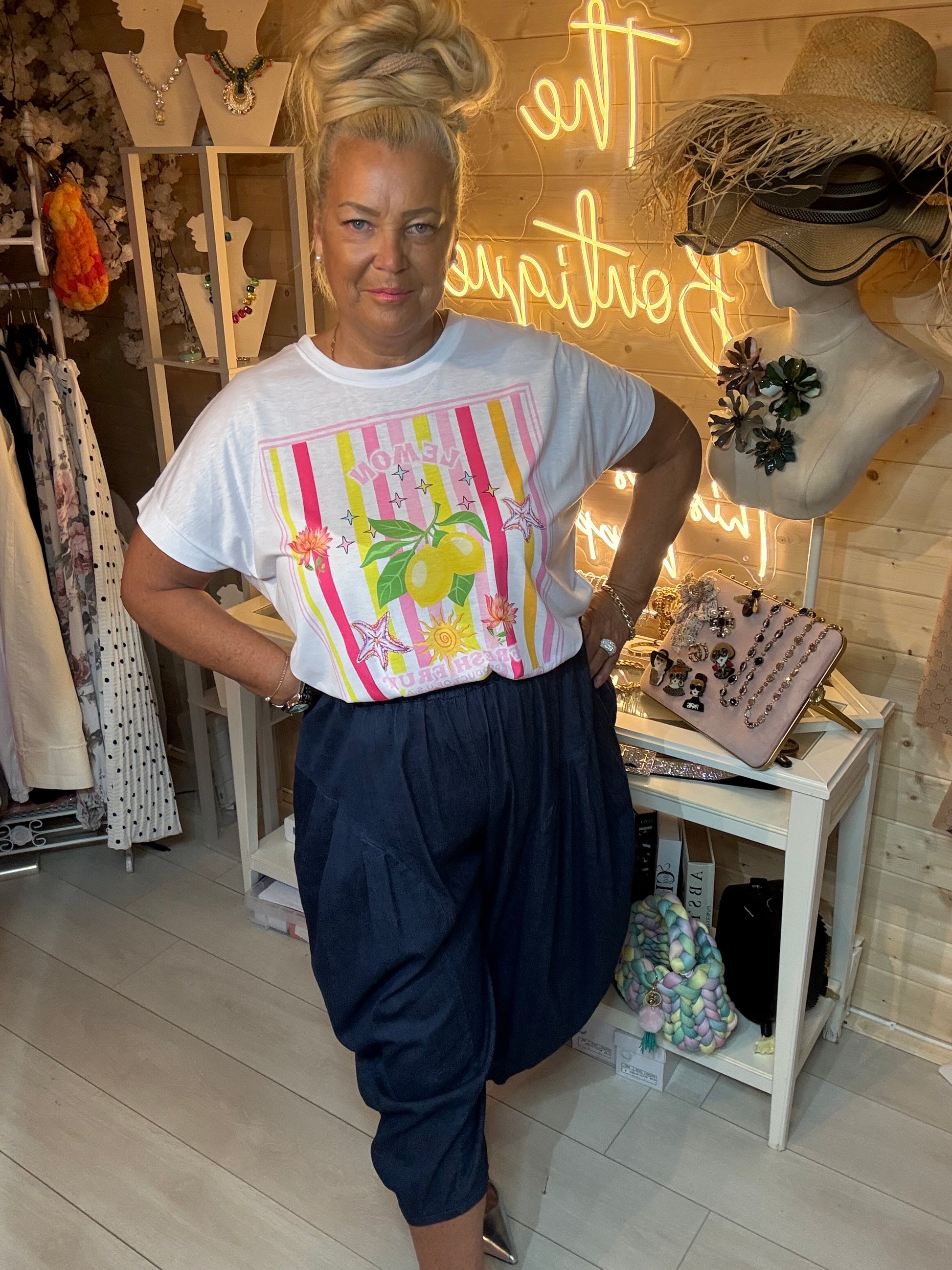 Limone lemon graphic tee boutique styling with denim trousers and silver heels