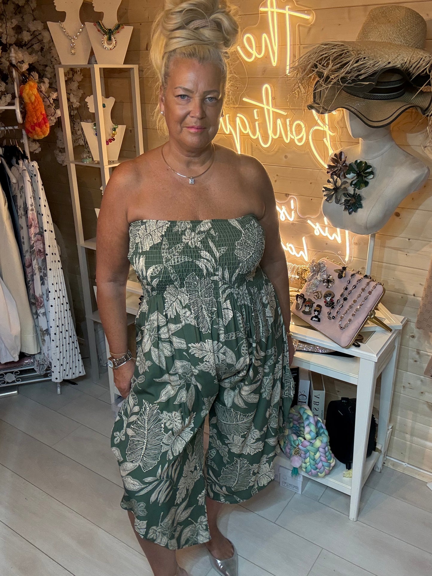 Tropez red tropical floral bandeau jumpsuit – front view with silver mules boutique styling