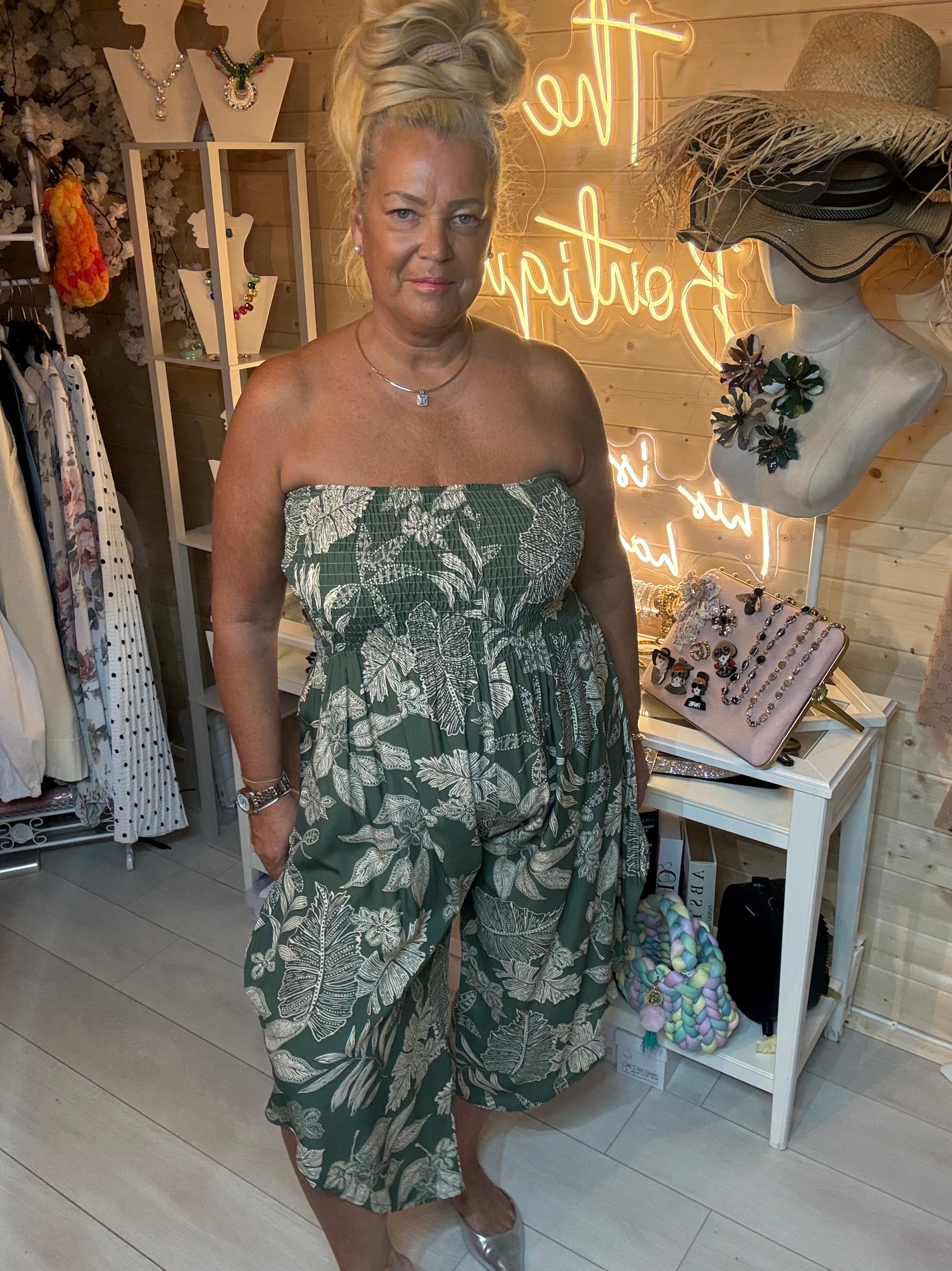 Tropez red tropical floral bandeau jumpsuit – front view with silver mules boutique styling