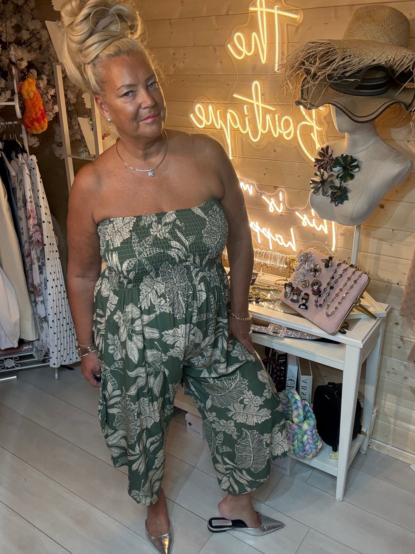 Tropez jumpsuit shown in both red and khaki colourways – tropical floral print one size 8-18