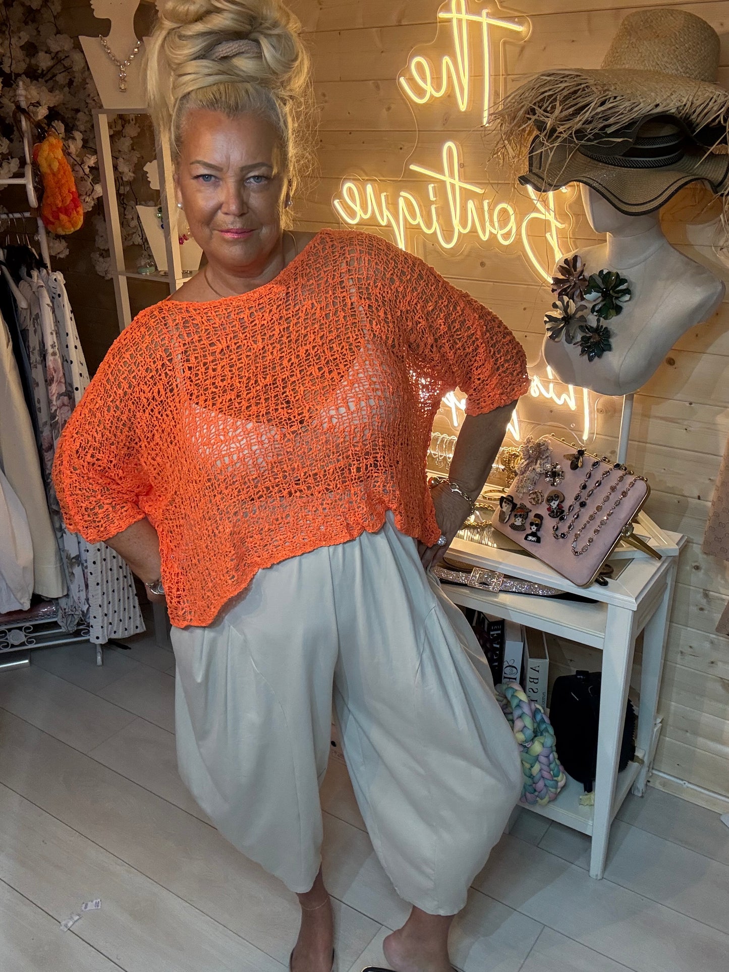 Mesh white open weave knit top – full length boutique view with grey harem trousers and silver mules