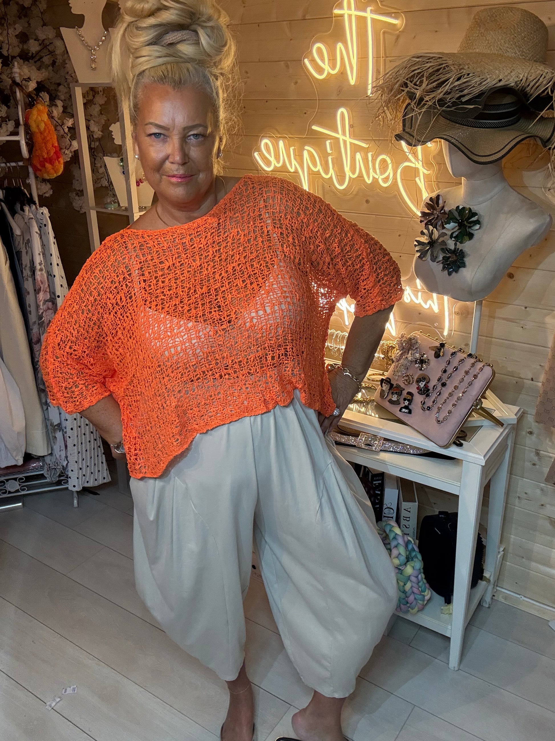 Mesh white open weave knit top – full length boutique view with grey harem trousers and silver mules