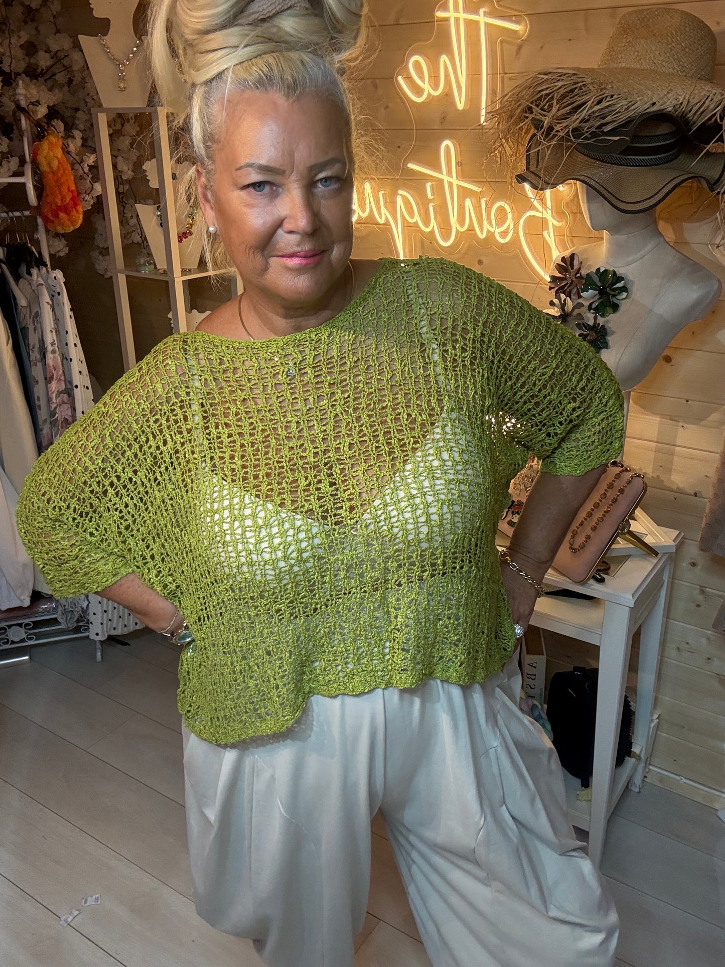 Woman wearing Mesh white open weave knit top – relaxed batwing style boutique styling