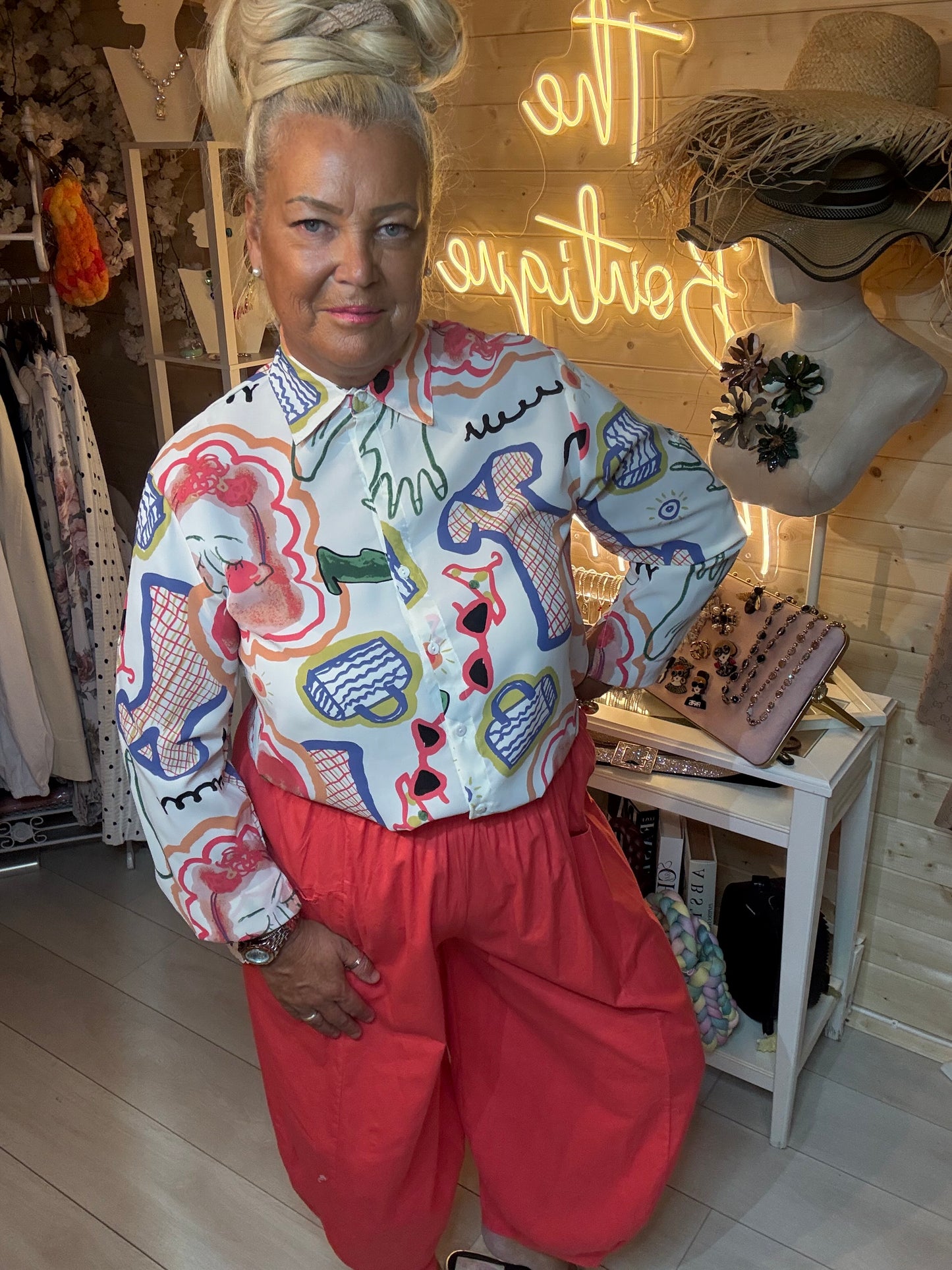 Sketch bold print blouse with coral harem trousers – boutique styling full length side angle