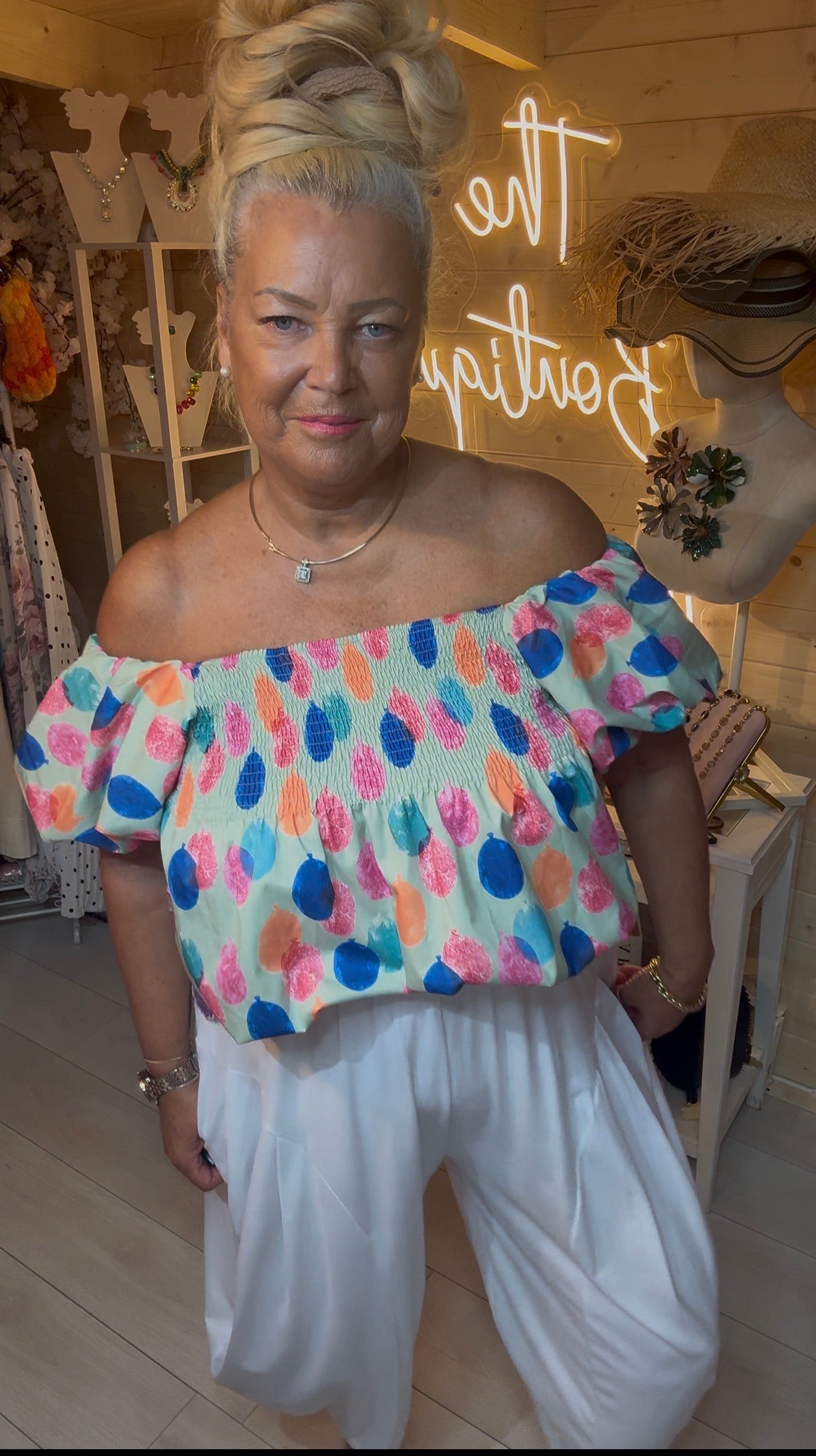Close up of Sorbet smocked elasticated bust and puff sleeve detail – off shoulder bardot top