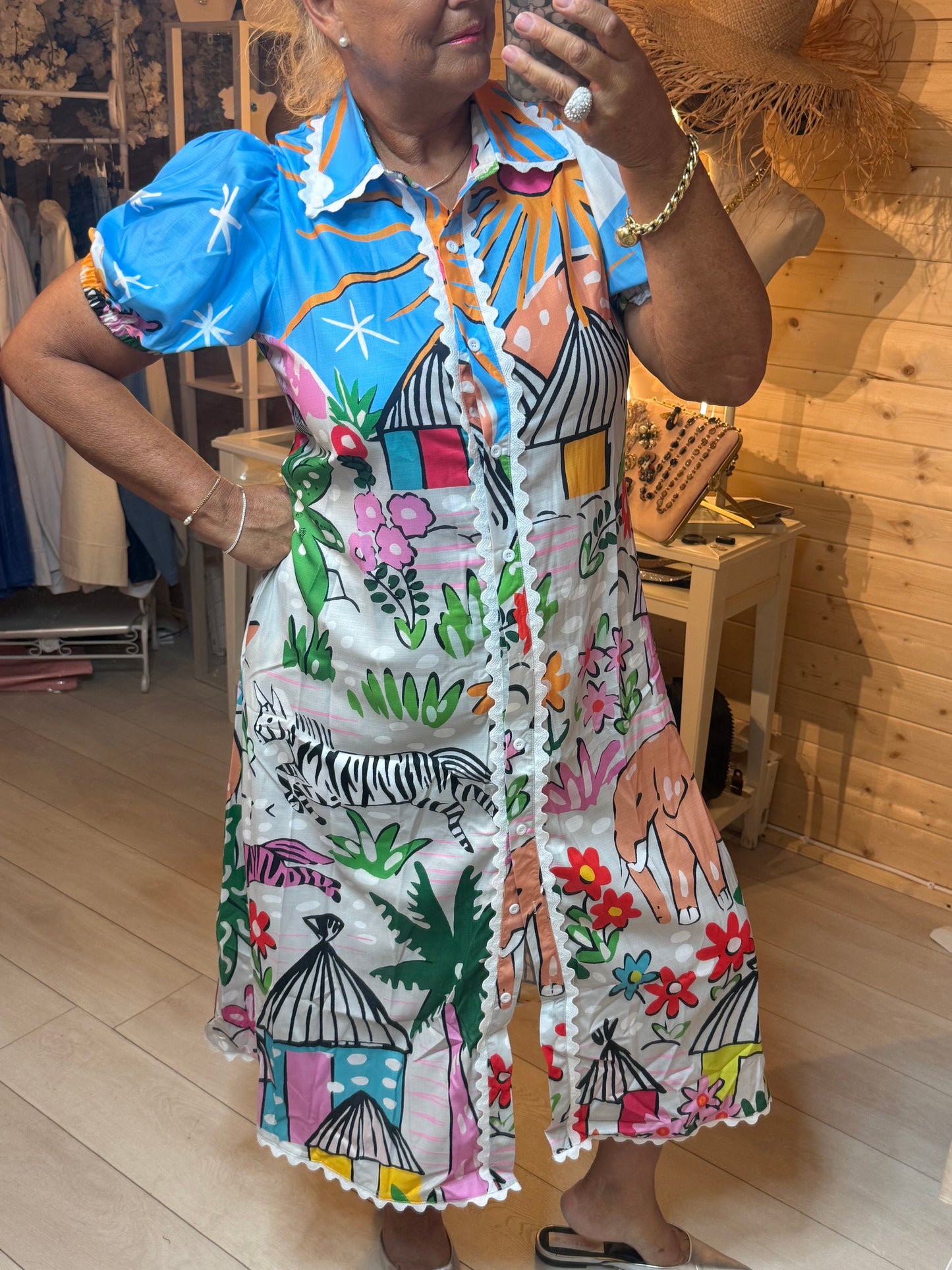Savanna Tropical Print Puff Sleeve Shirt Dress - close up of tropical print and scallop hem detail - One Size 8-16 - The Ultimate Ladies Boutique