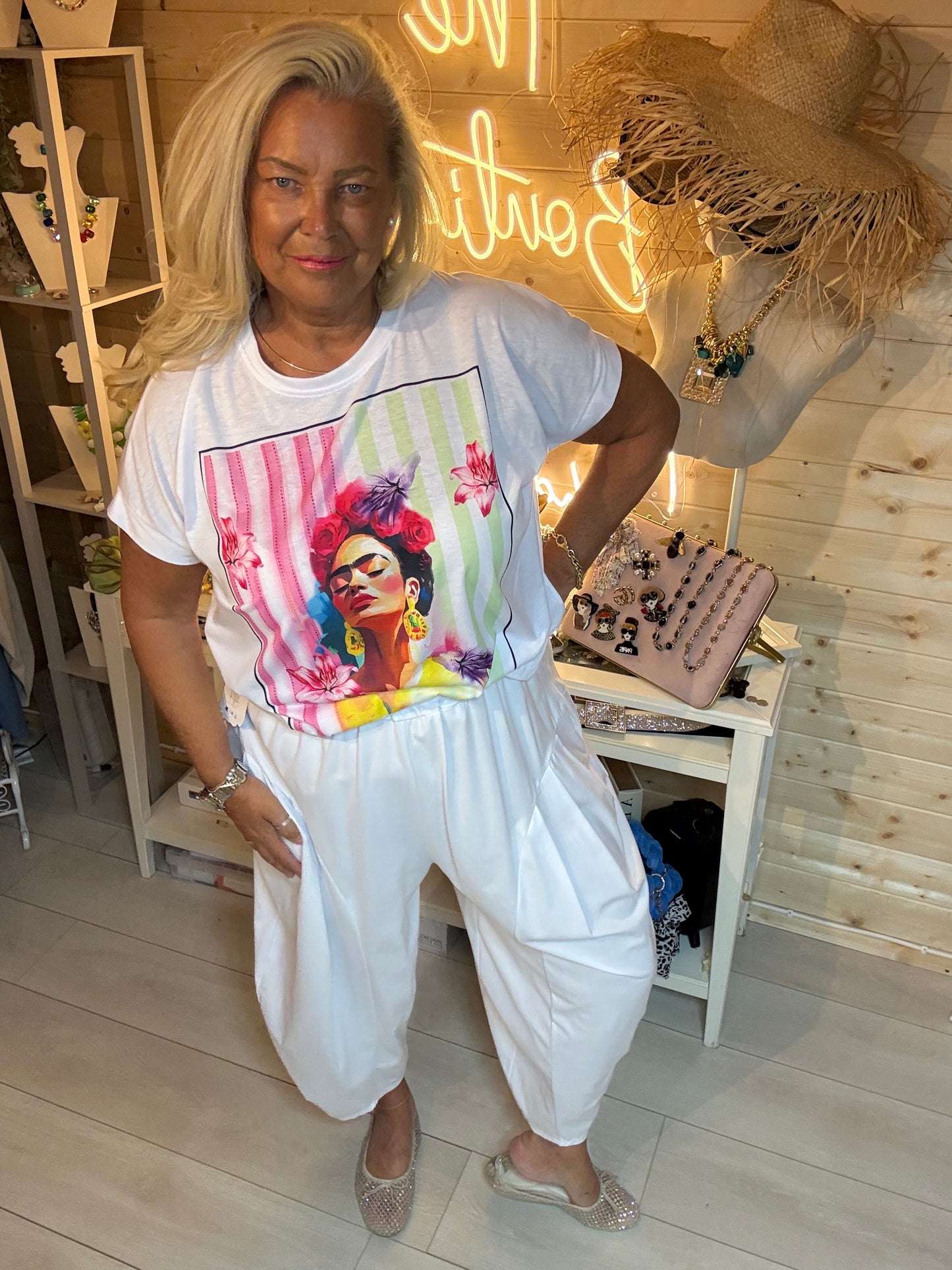 Frida Floral Portrait Graphic T-Shirt in White - full length front view styled with white harem trousers - One Size 8-18 - The Ultimate Ladies Boutique
