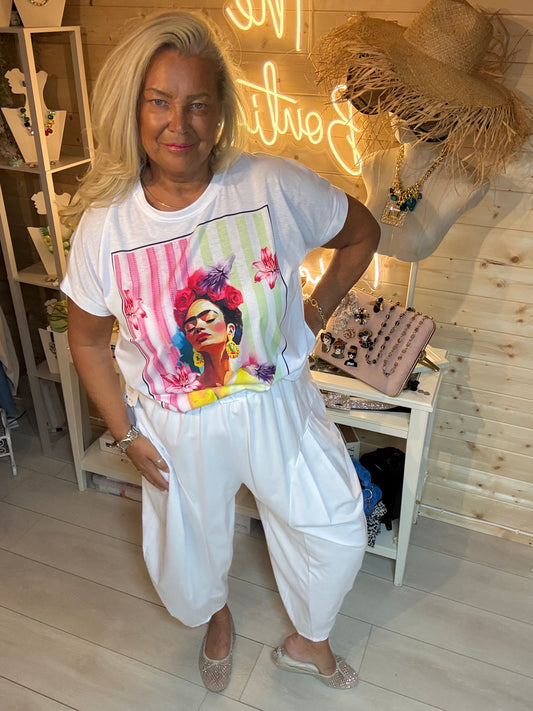 Frida Floral Portrait Graphic T-Shirt in White - full length front view styled with white harem trousers - One Size 8-18 - The Ultimate Ladies Boutique