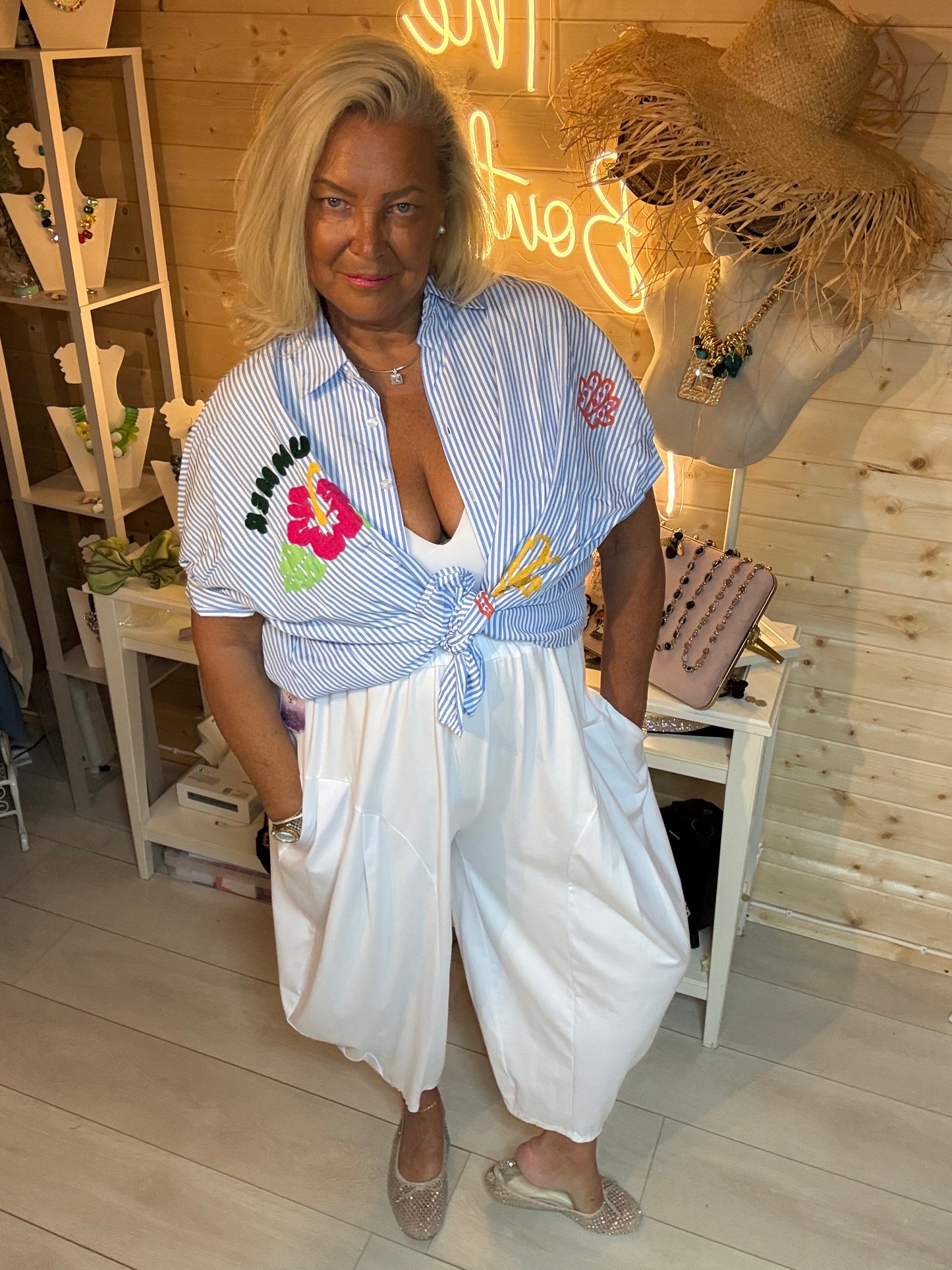 Hibiscus Summer Slogan Stripe Shirt tied at waist over white harem trousers - front view - One Size 8-20 - The Ultimate Ladies Boutique