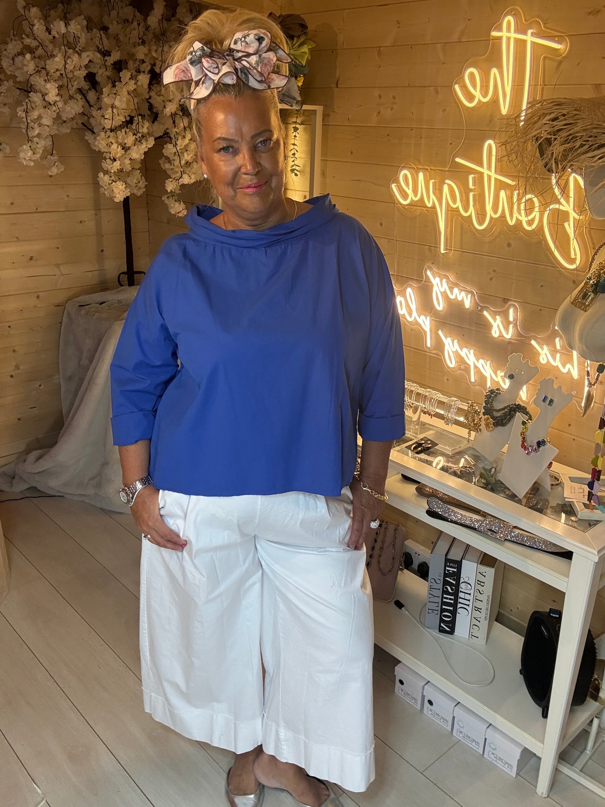Nova cobalt blue cowl neck top full length front view styled with white culottes