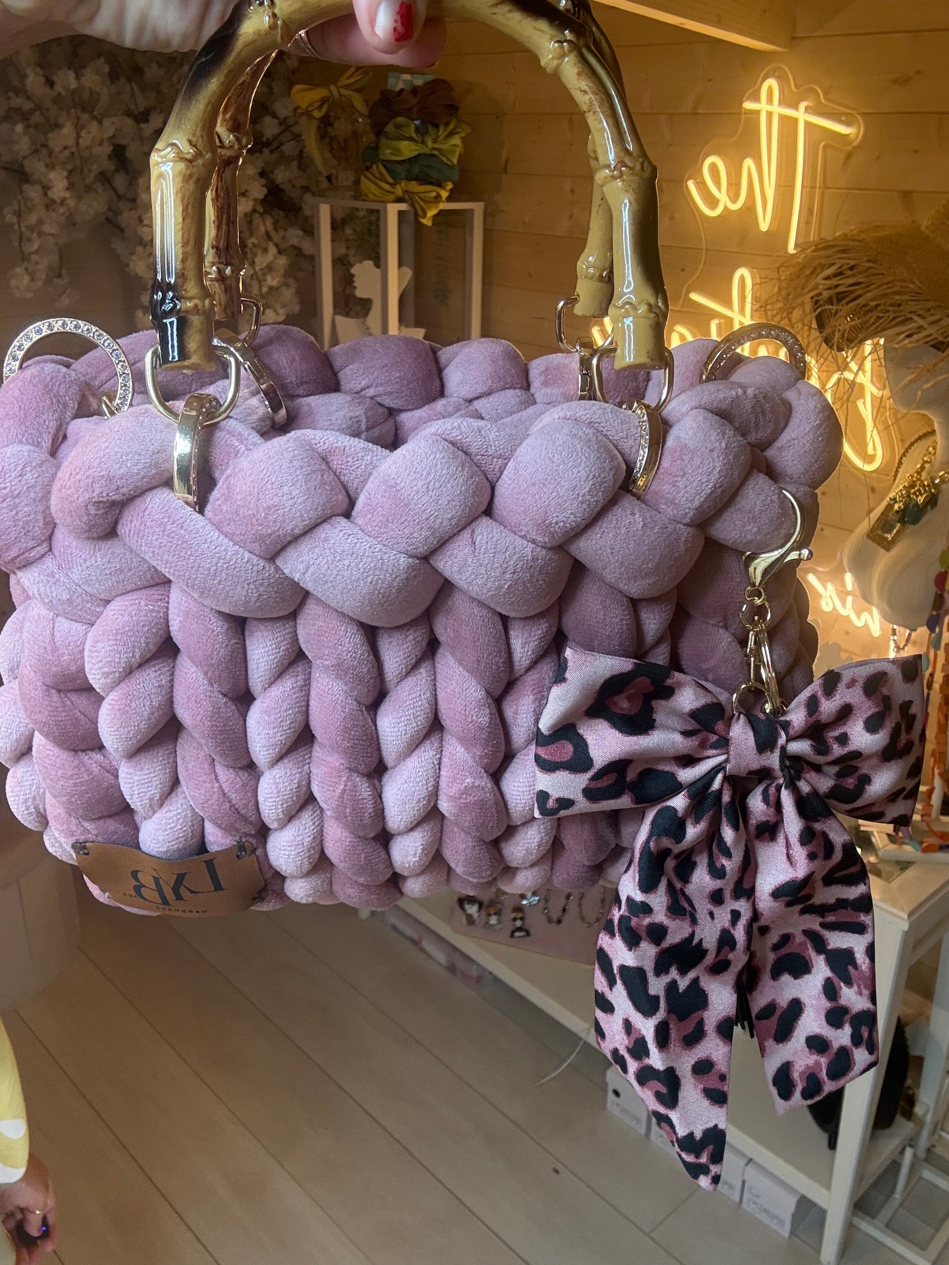 Lavinia lilac chunky woven tote bag with gold bamboo handle and leopard bow charm – front view