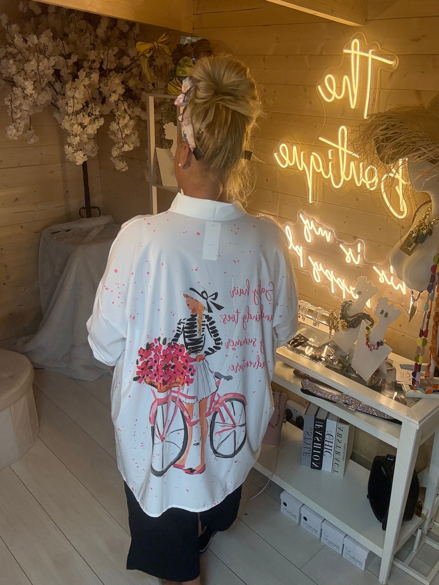 Colette Parisian print shirt back view showing script quote and bicycle illustration
