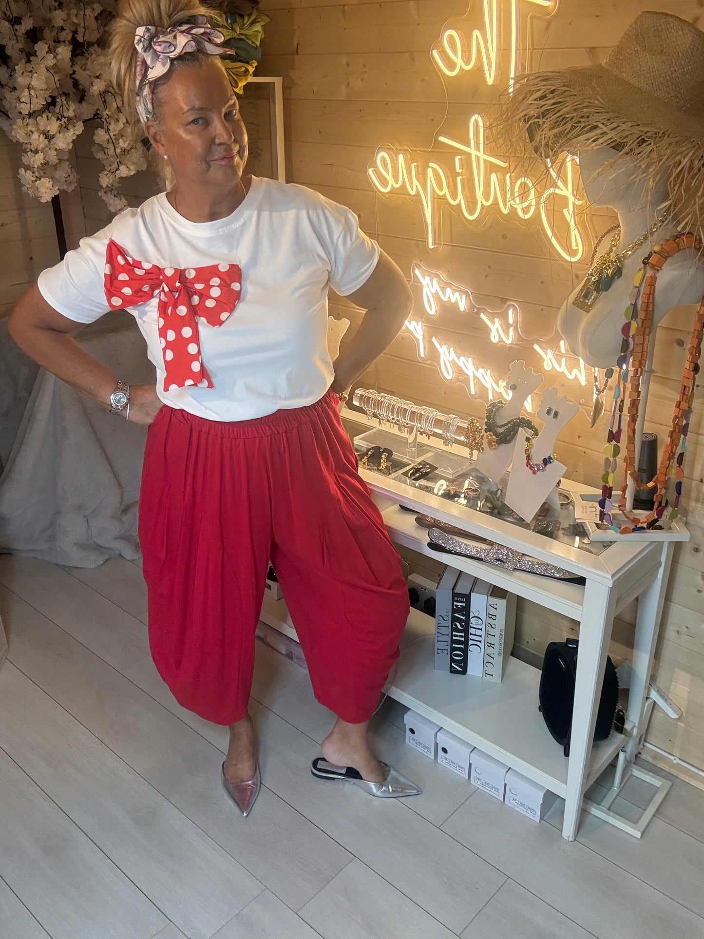 Minnie polka dot bow t-shirt one size 8-16 – full length front view on model with red harem trousers