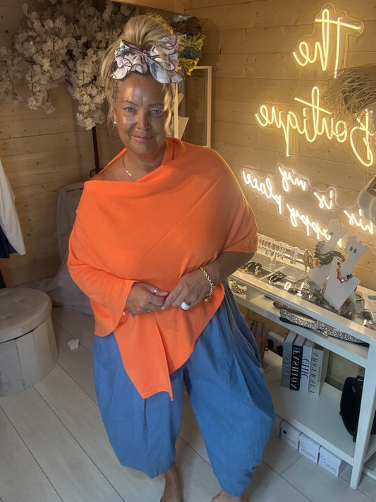 Brezza lime poncho cape side view on model showing draped cowl neckline – The Ultimate Ladies Boutique