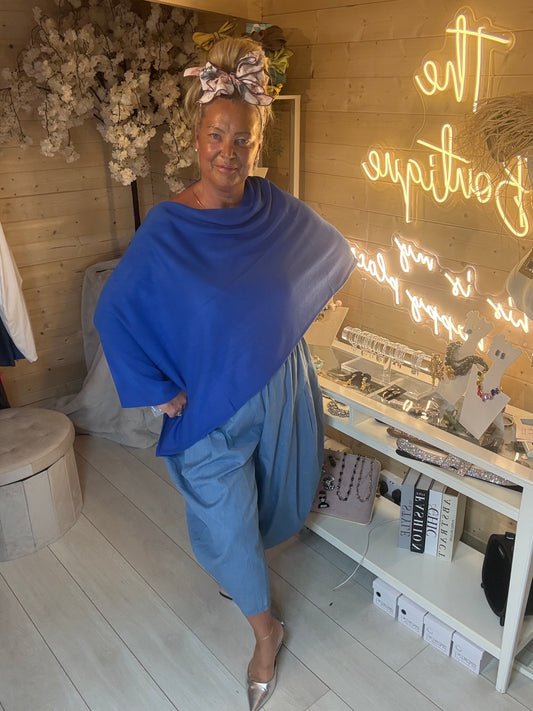 Brezza cobalt blue poncho cape three quarter view on model – boutique lightweight cape