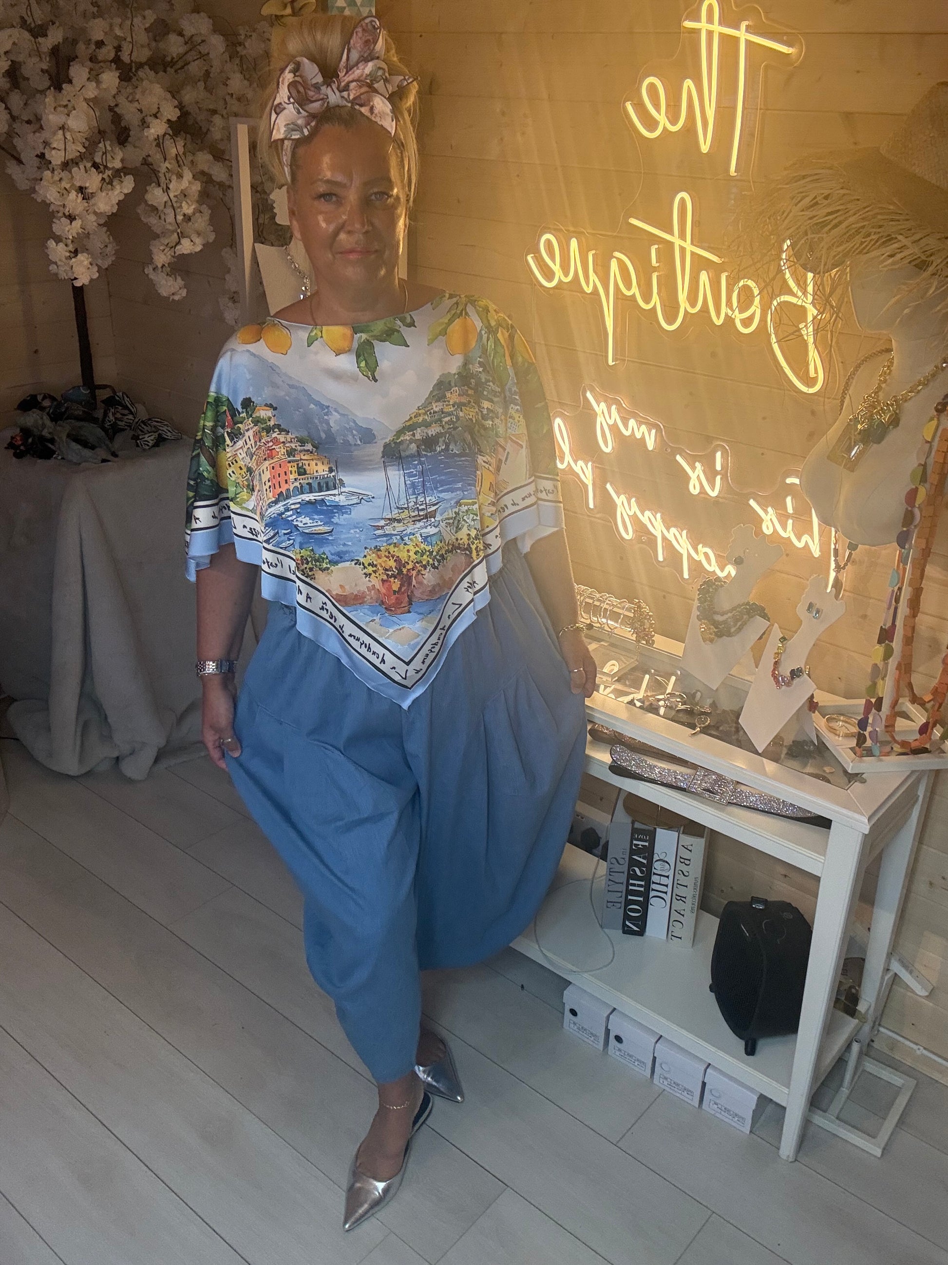 Side view of Amalfi Poncho Top showing relaxed poncho silhouette and Amalfi Coast print detail