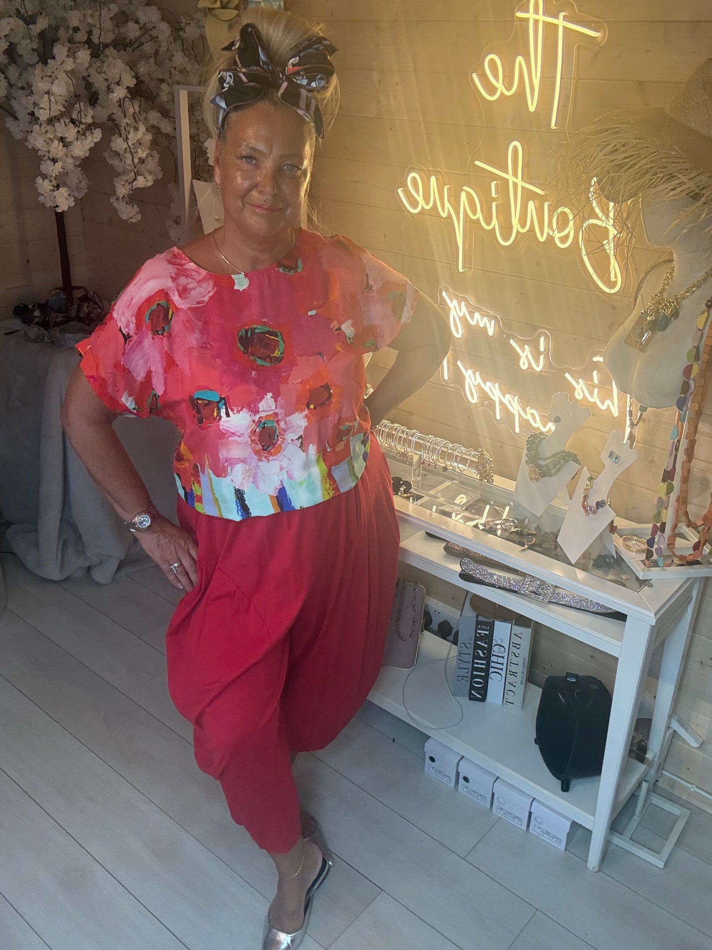 Sorento Coral Abstract Floral Poncho Top full length outfit view with coral harem trousers and silver flat shoes