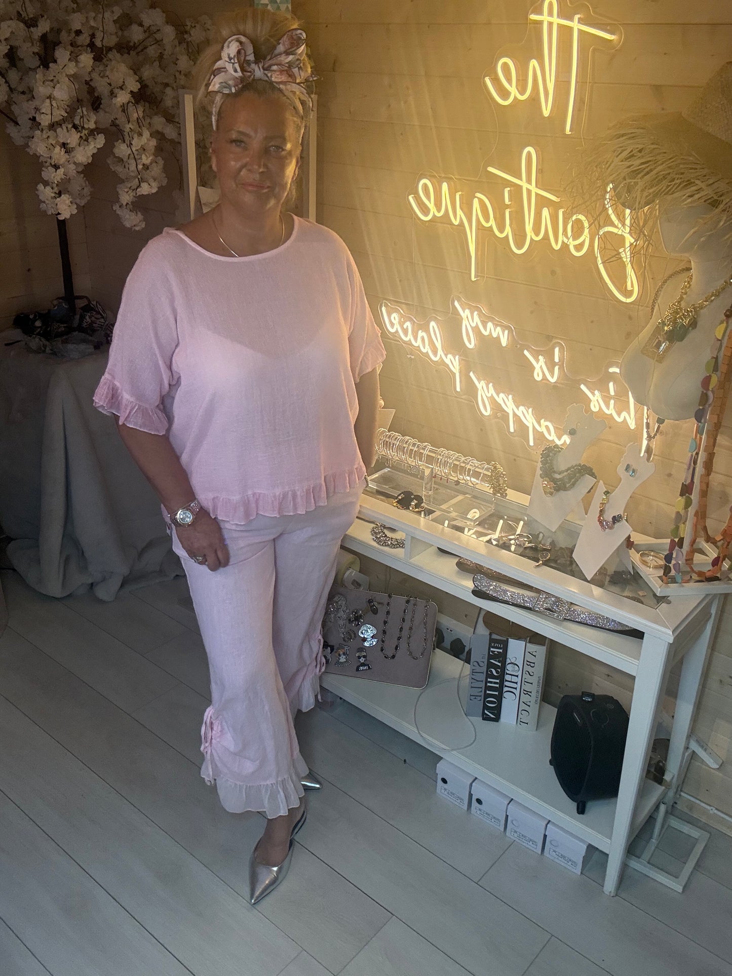 Full length view of Rosa Blush Pink Ruffle Hem Crinkle Top styled with pink Sky Shimmer Ruffle Linen Trousers and silver heels