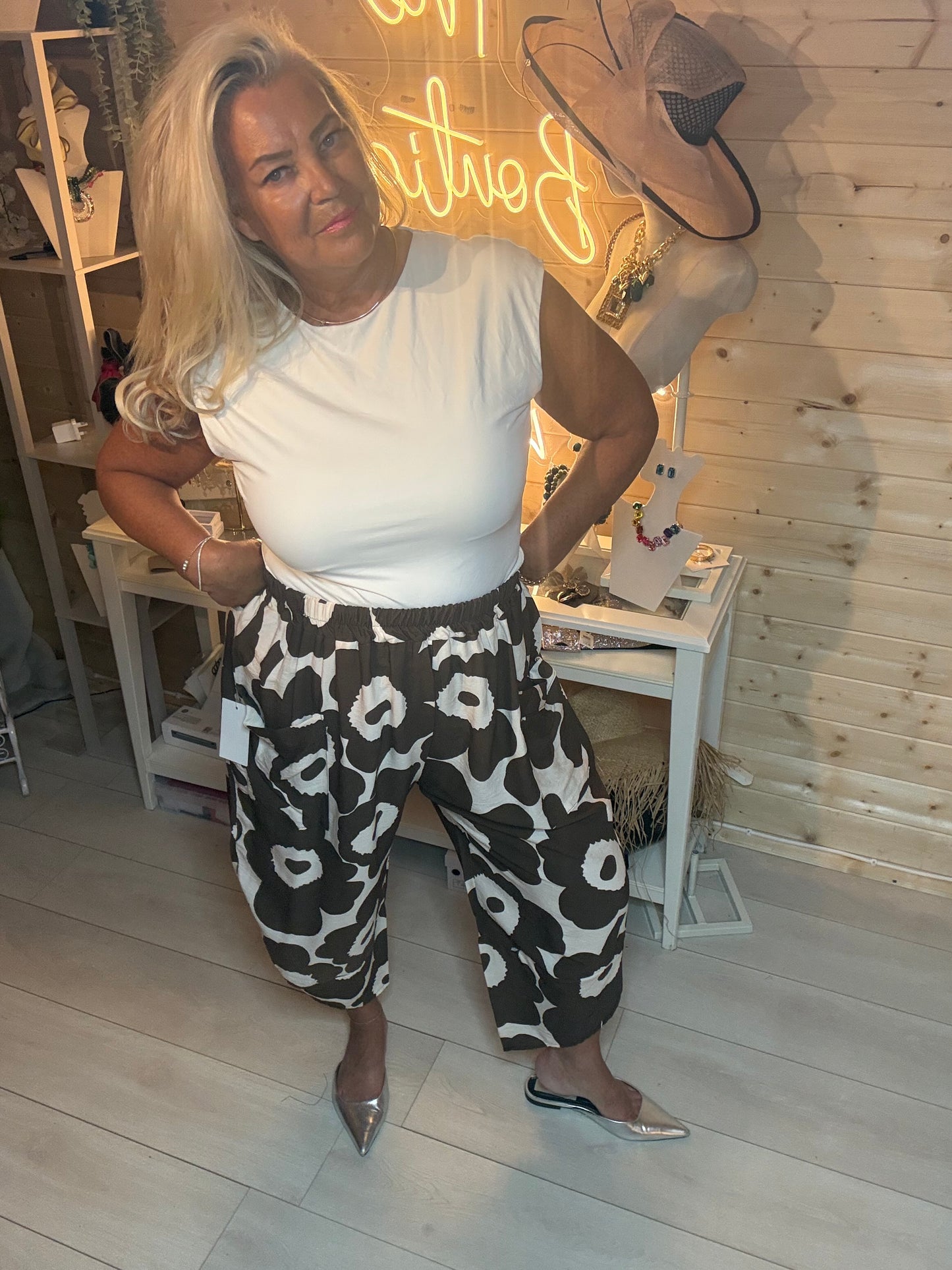 Mocha floral oversized slouch trousers – full length view showing elasticated waist and cropped length