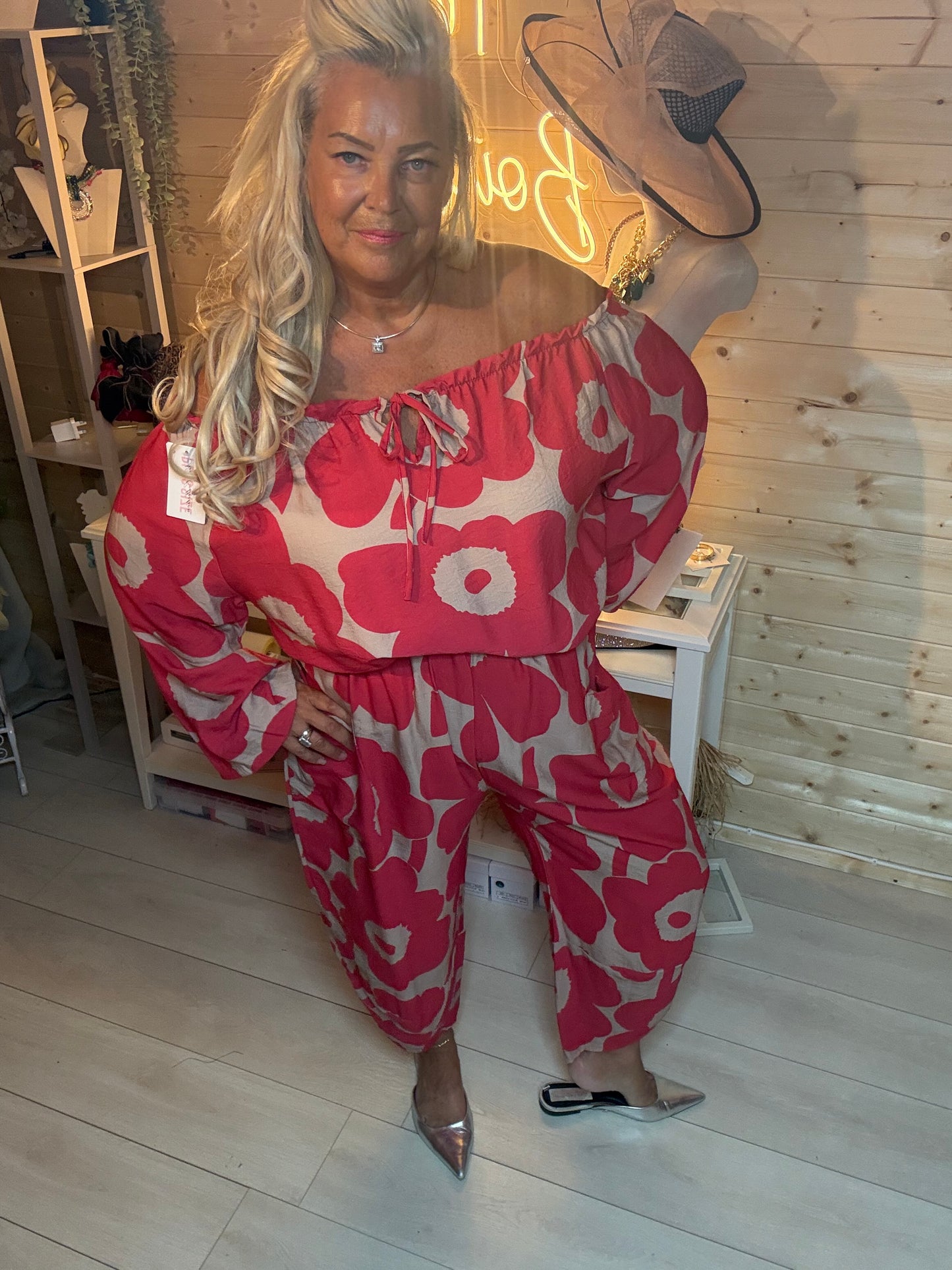 Red floral slouch trousers styled with matching off-shoulder bardot top – boutique look