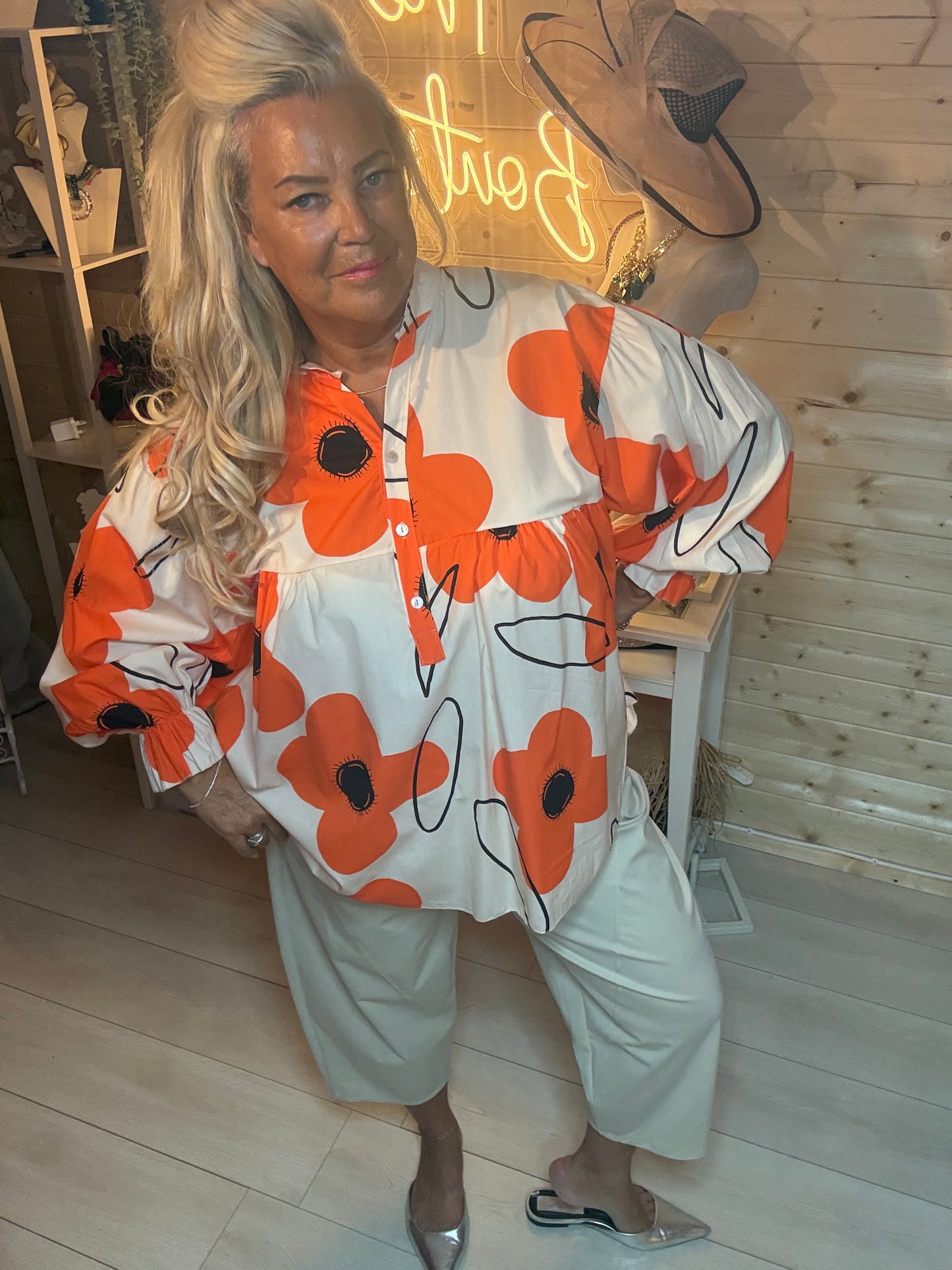Orange floral oversized blouse – full length side view showing floaty silhouette and button placket neckline
