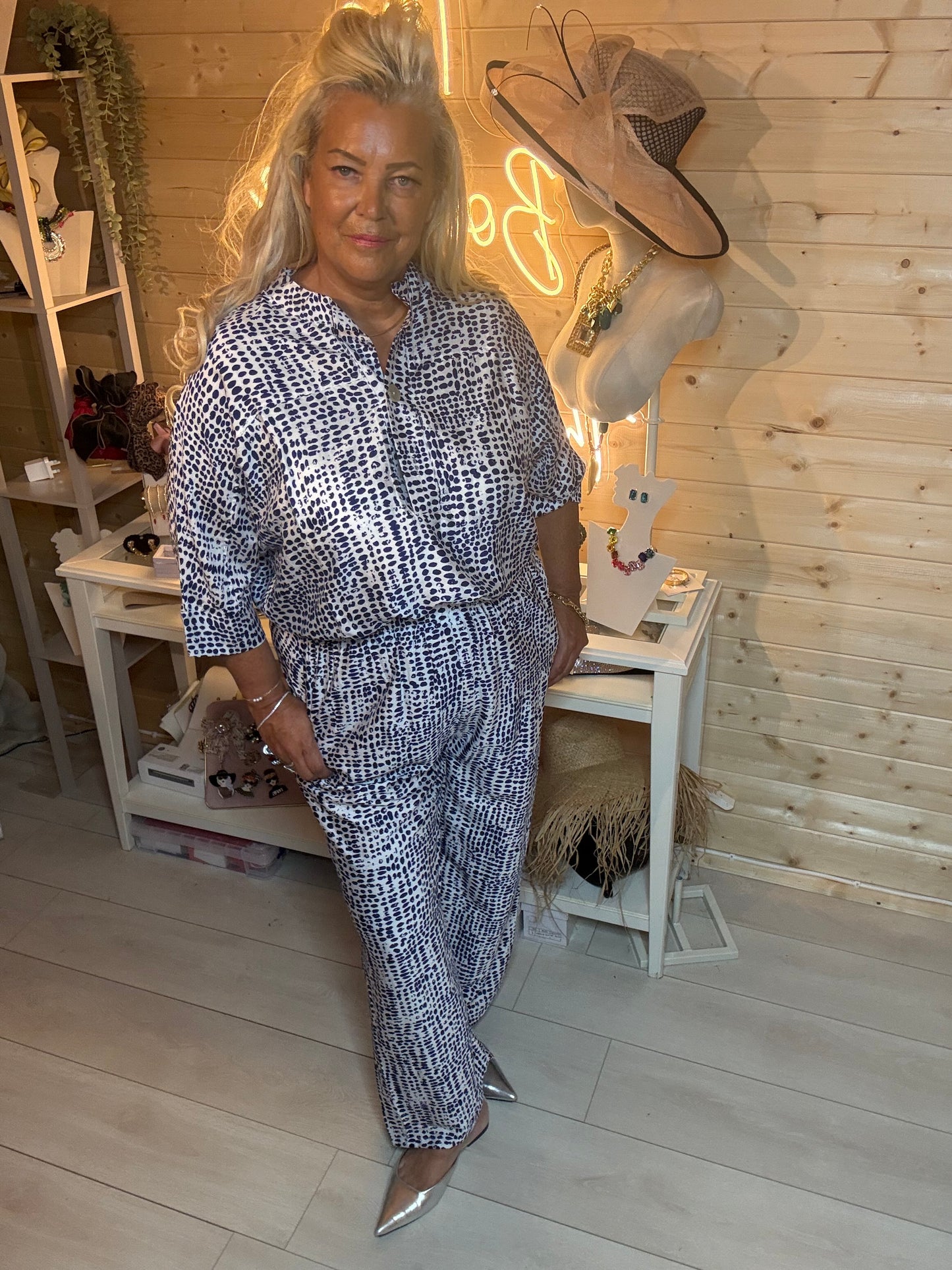 Navy abstract print shirt and wide-leg trouser co-ord set – three quarter length boutique shot showing full silhouette and elasticated waist trouser detail