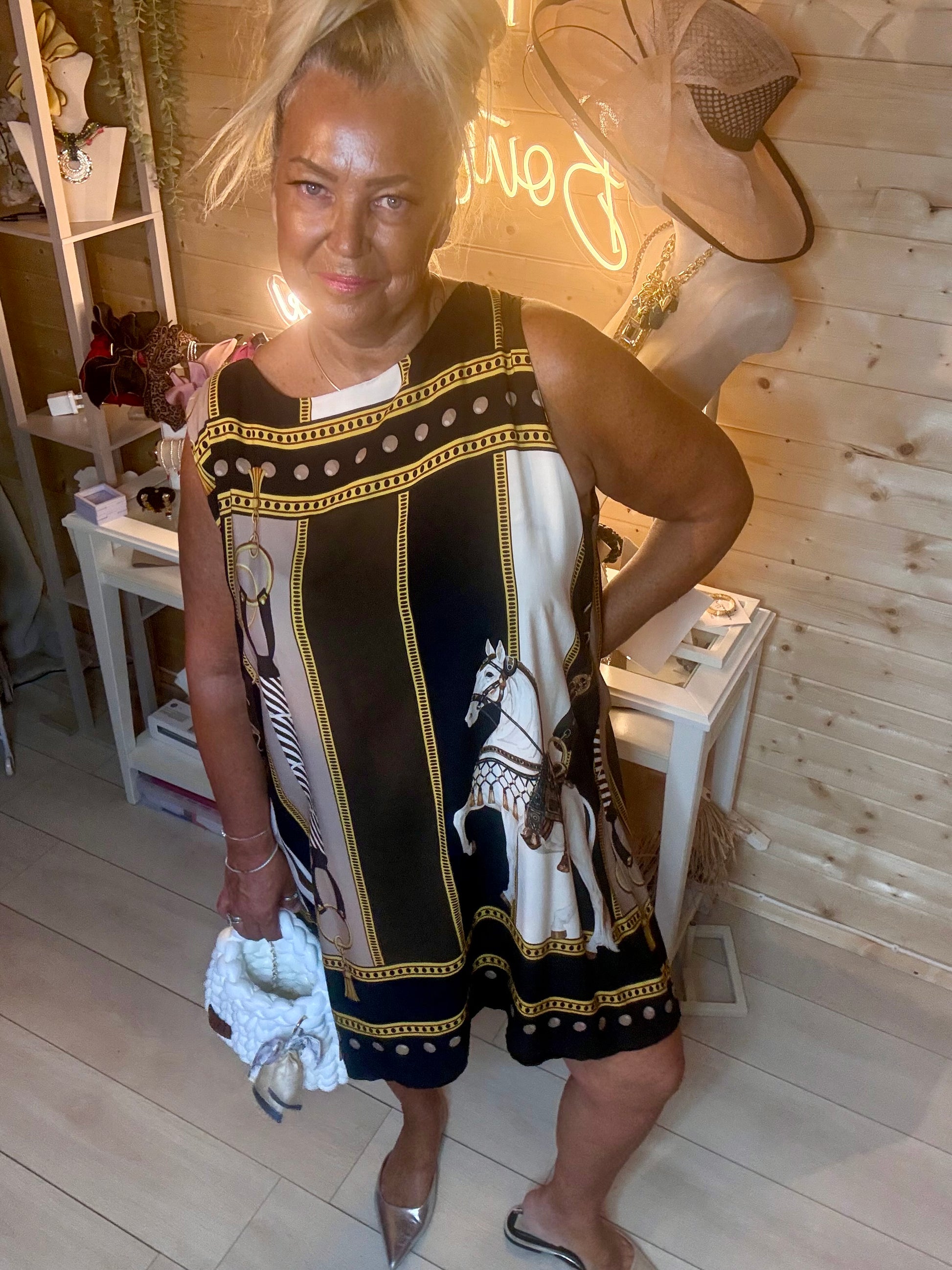 Brown equestrian print shift dress – full length boutique shot showing relaxed A-line silhouette and scarf-style panel design in brown colourway