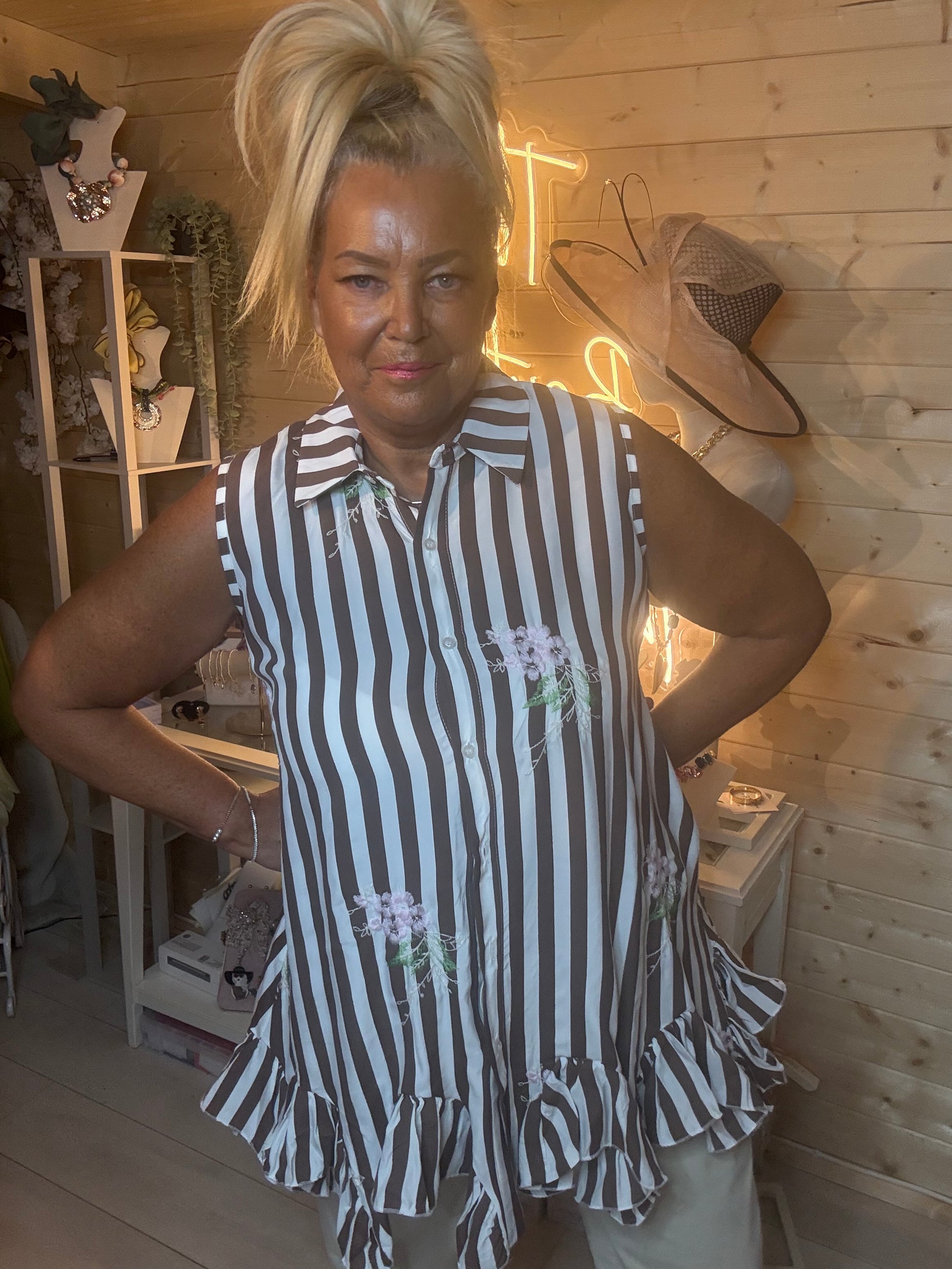 Navy stripe ruffle hem tunic – close up front view showing classic shirt collar, button placket and delicate white floral embroidery detail