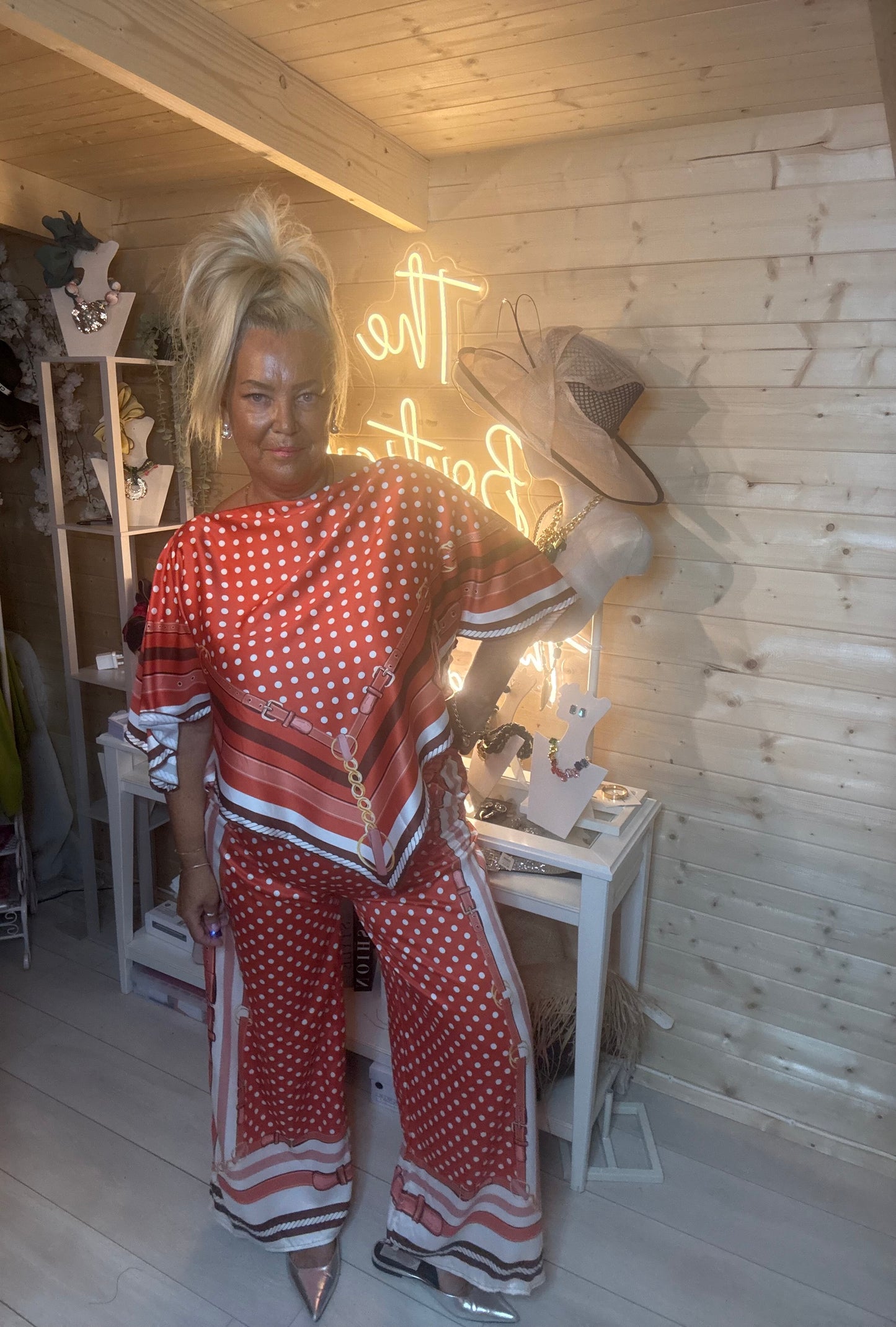 Rust polka dot co-ord set – full length boutique shot showing relaxed batwing top and wide-leg trousers with coordinating scarf print hem detail