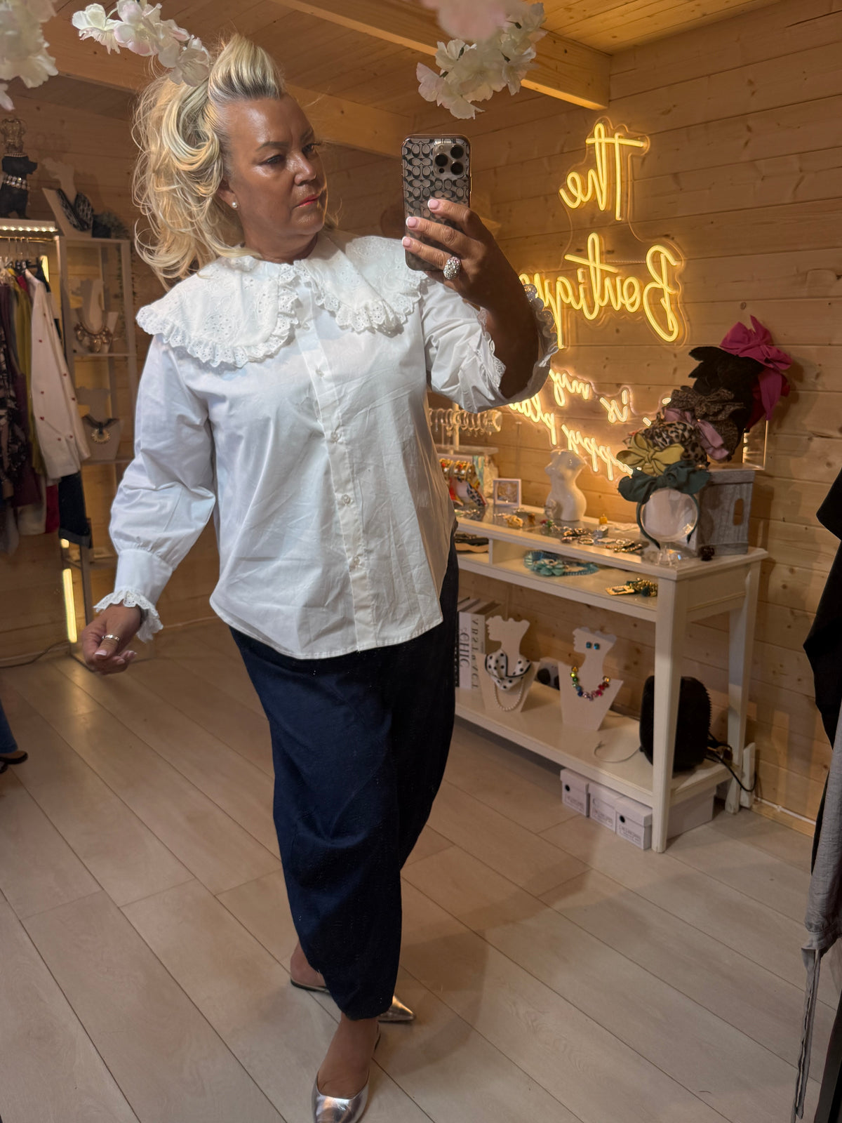 Versailles white broderie anglaise collar blouse styled with dark navy slouch trousers and silver mules