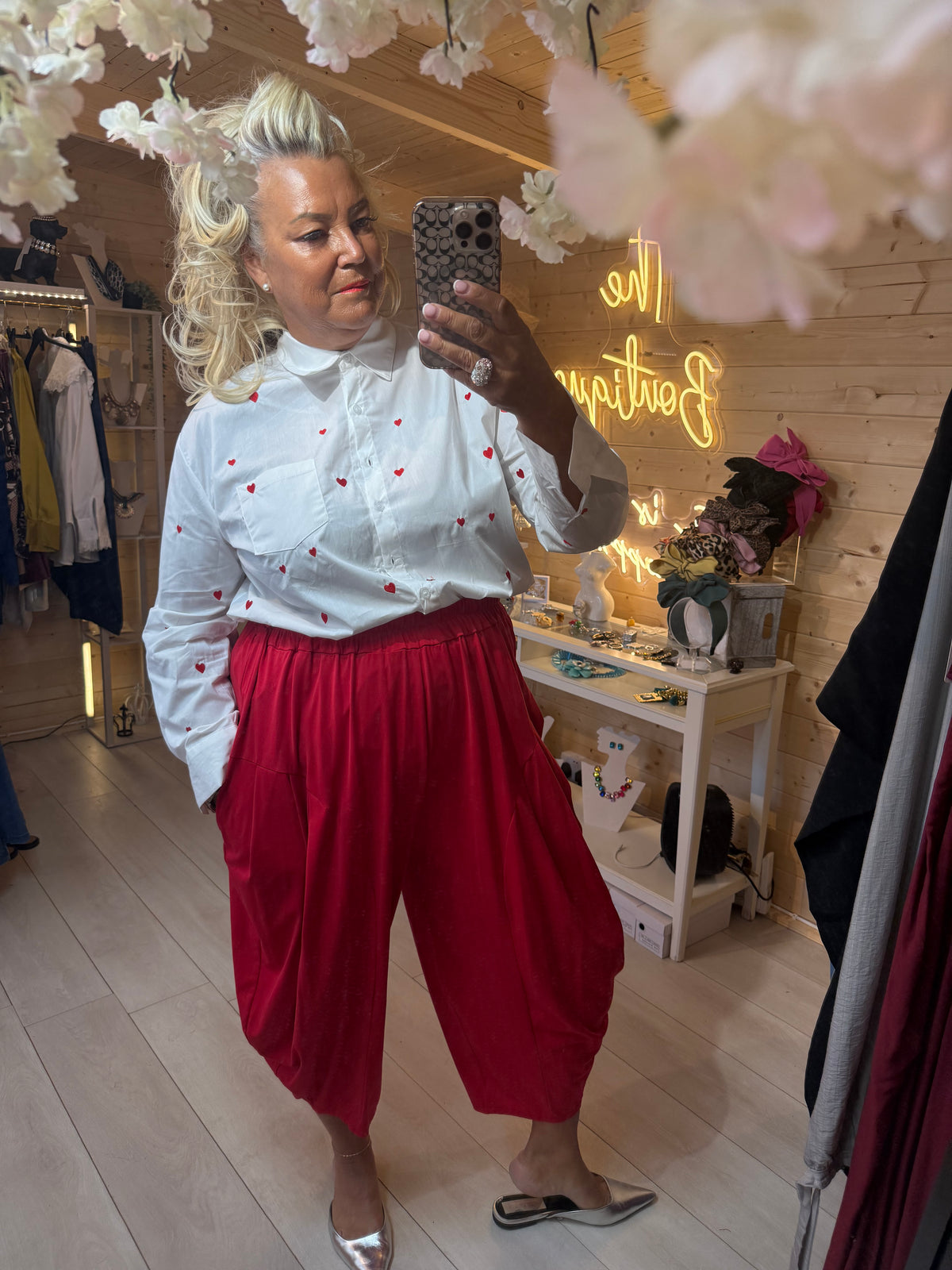 Cuore white heart shirt and red trouser co-ord mirror selfie at The Ultimate Ladies Boutique