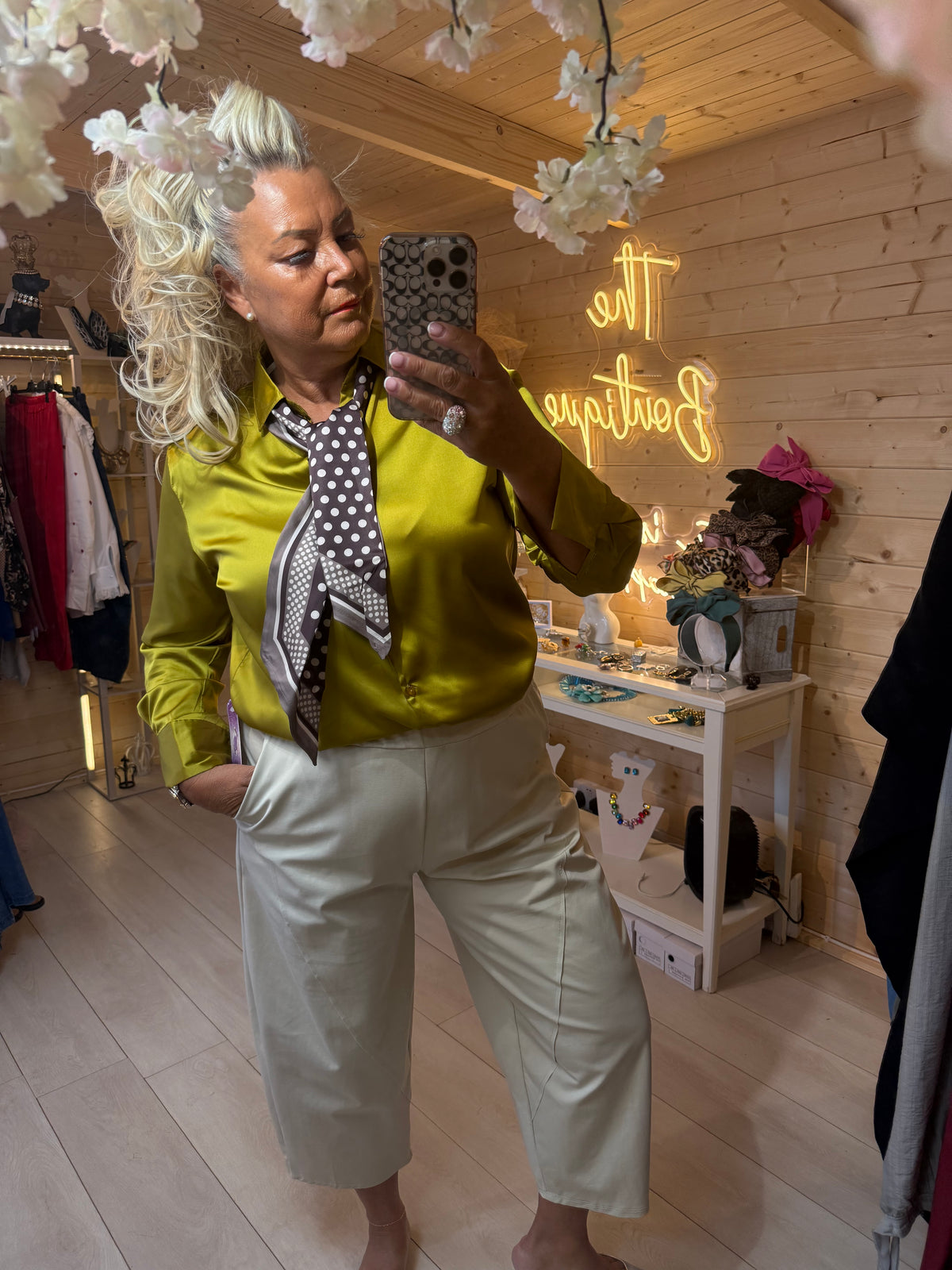 Queen of Hearts olive gold satin shirt with scarf tie styled with stone capri trousers boutique shot