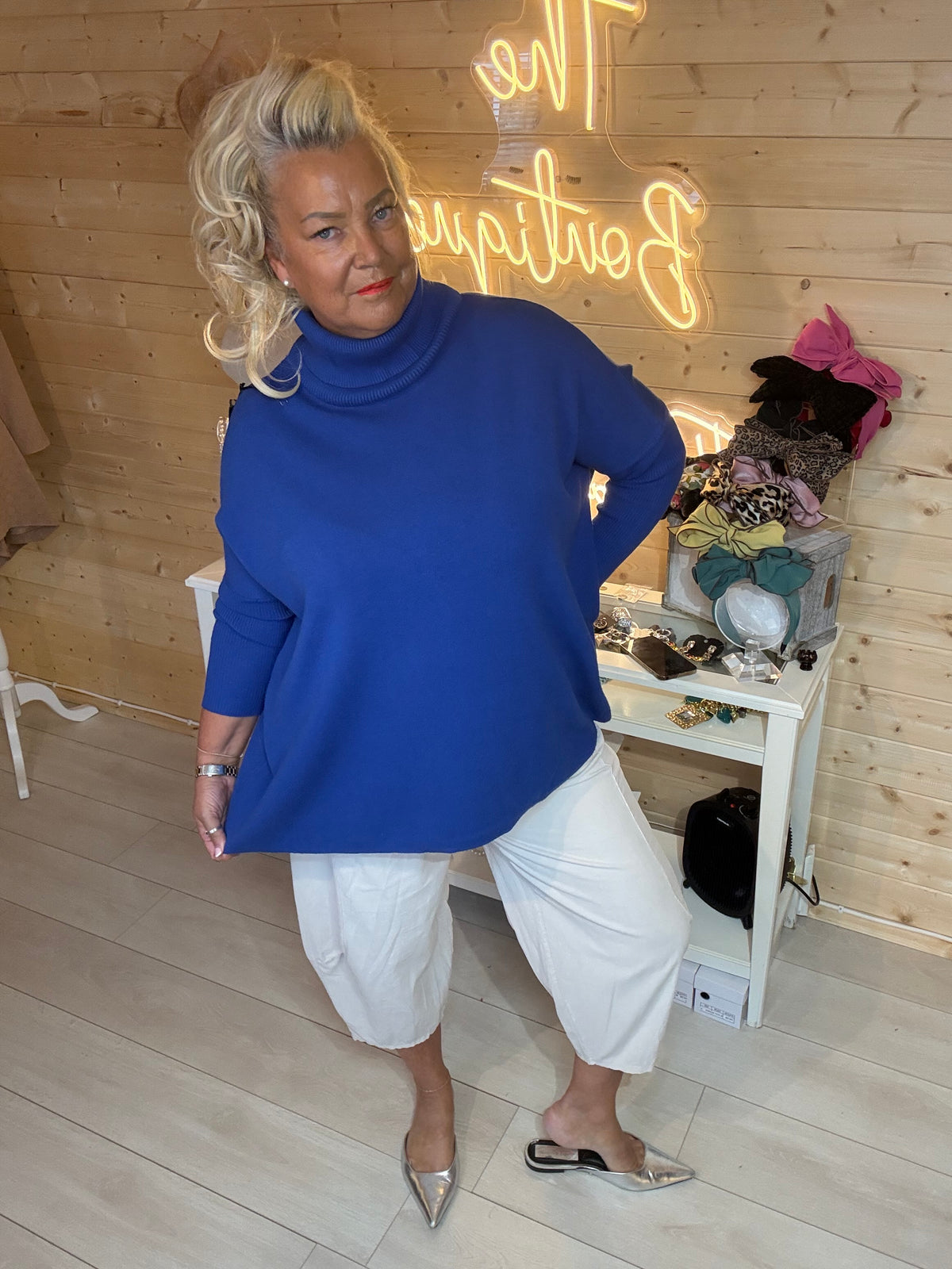 Pola hot pink oversized roll neck jumper mirror selfie styled with Black Magic Trousers and chain slides