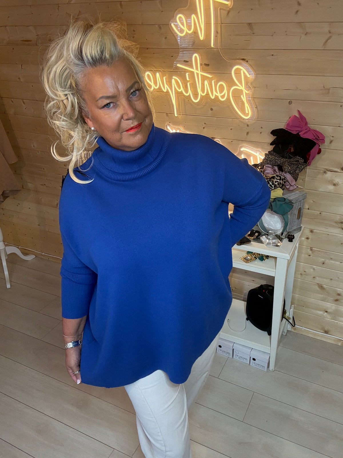 Pola cobalt blue oversized roll neck jumper mirror selfie with white Pocket Slouch Trousers and gold flats